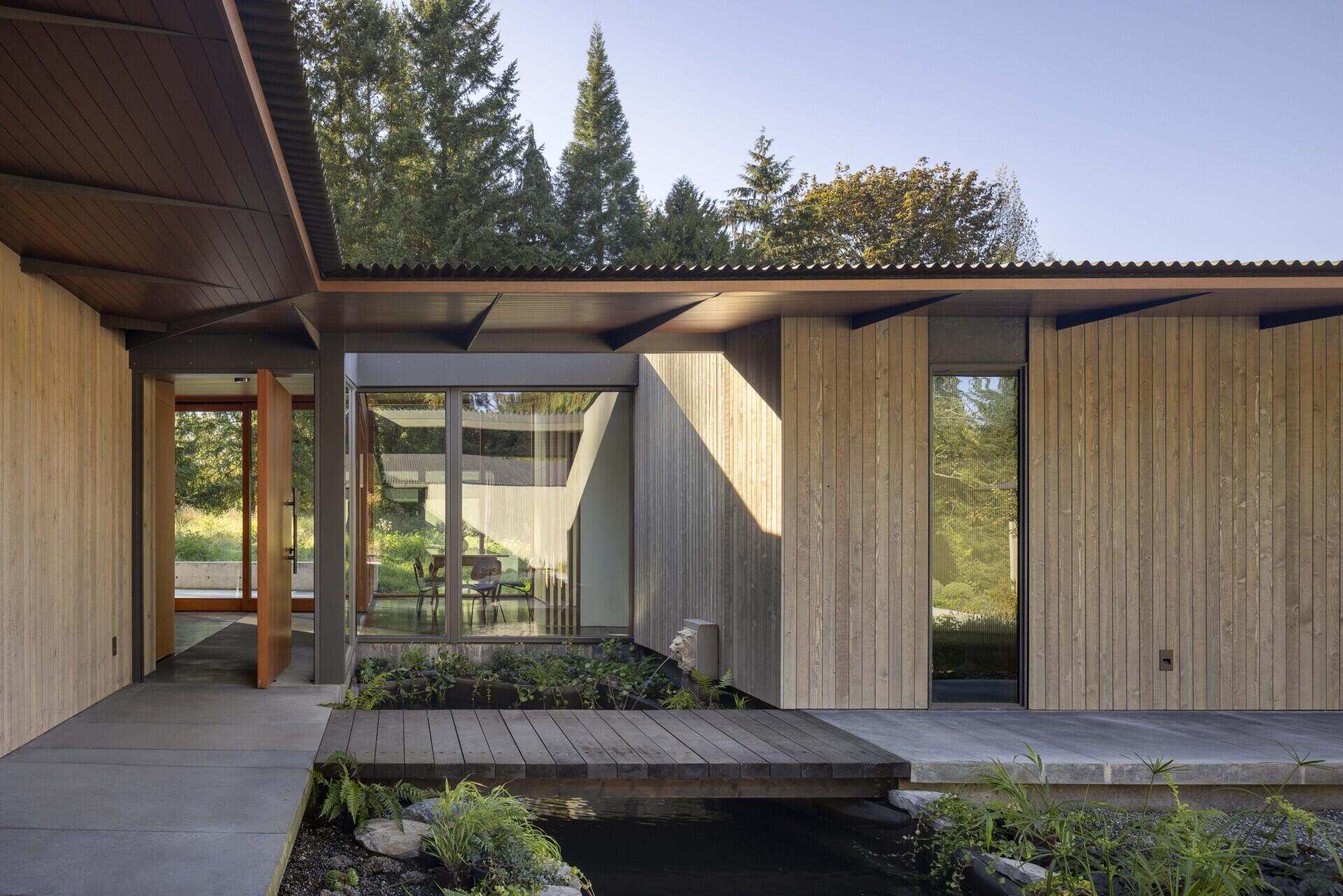 Reflecting pools, rain-fed gardens, and native plantings weave this home into its natural setting. Inspired by an ancient Roman impluvium, water cascades from broad eaves into shallow pools, turning rainfall into a living, ever-changing landscape.
