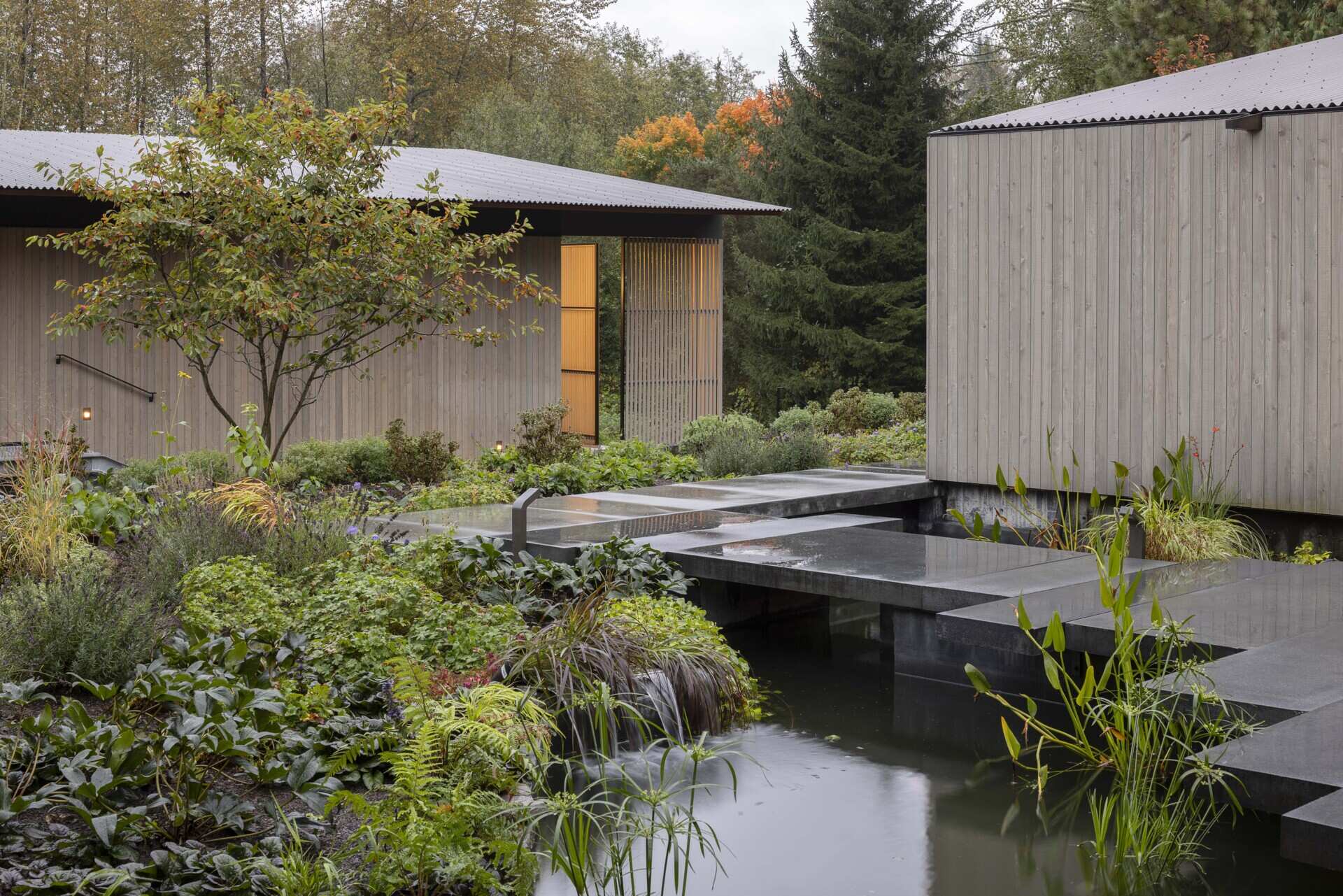 Reflecting pools, rain-fed gardens, and native plantings weave this home into its natural setting. Inspired by an ancient Roman impluvium, water cascades from broad eaves into shallow pools, turning rainfall into a living, ever-changing landscape.