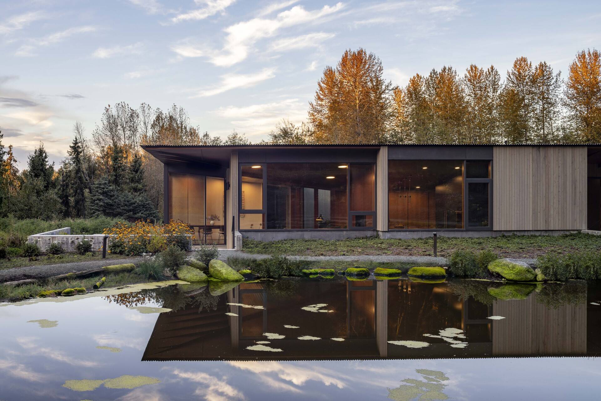 Reflecting pools, rain-fed gardens, and native plantings weave this home into its natural setting. Inspired by an ancient Roman impluvium, water cascades from broad eaves into shallow pools, turning rainfall into a living, ever-changing landscape.