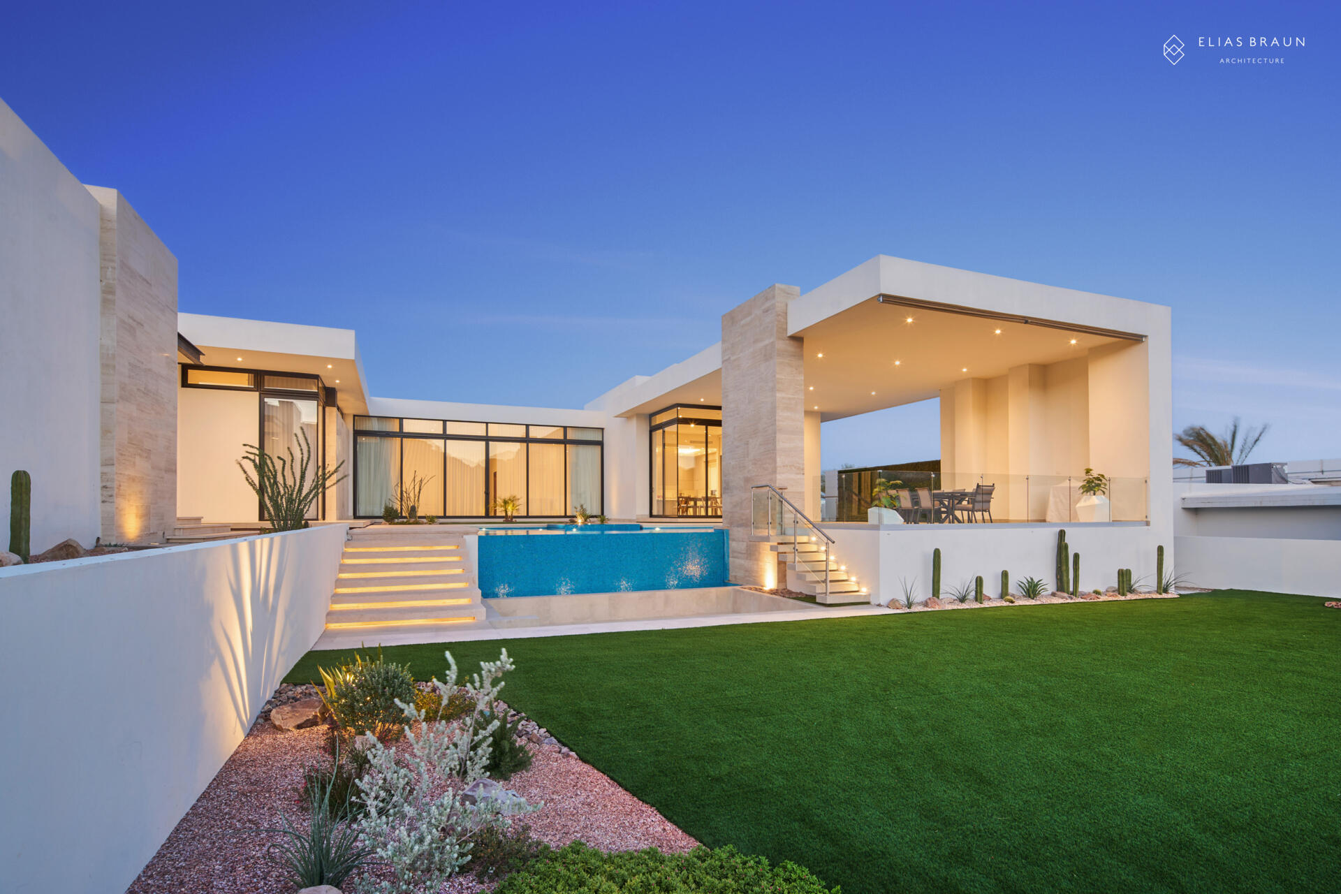 A stepped desert home where water and air define the experience. The infinity pool meets the horizon, while a central courtyard gathers breezes and connects the main house with the guest wing. Travertine terraces and soft light make every transition, from swim to social, effortless.