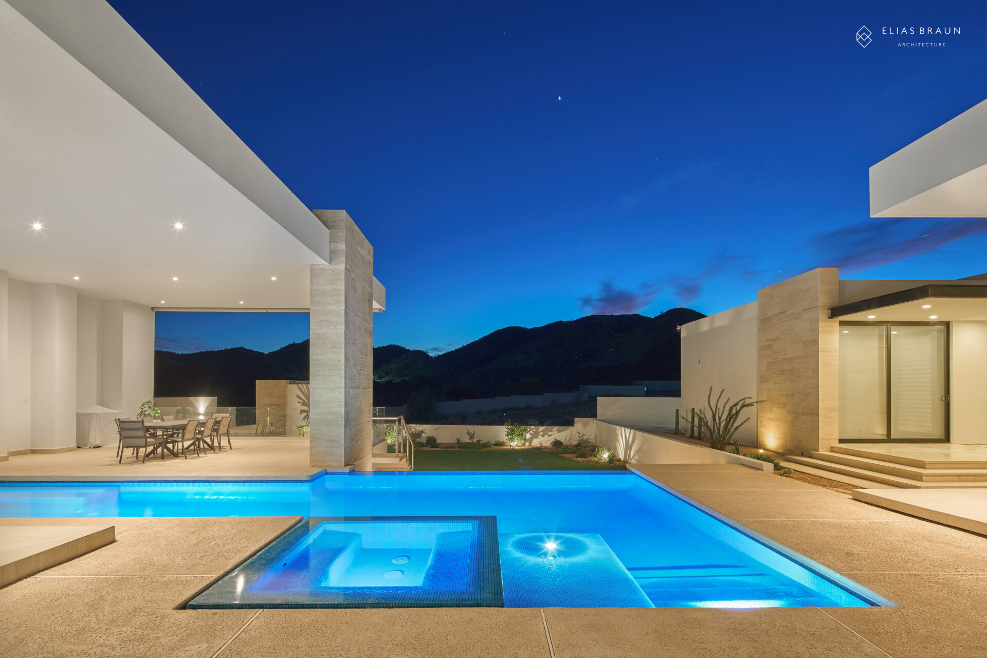 A stepped desert home where water and air define the experience. The infinity pool meets the horizon, while a central courtyard gathers breezes and connects the main house with the guest wing. Travertine terraces and soft light make every transition, from swim to social, effortless.