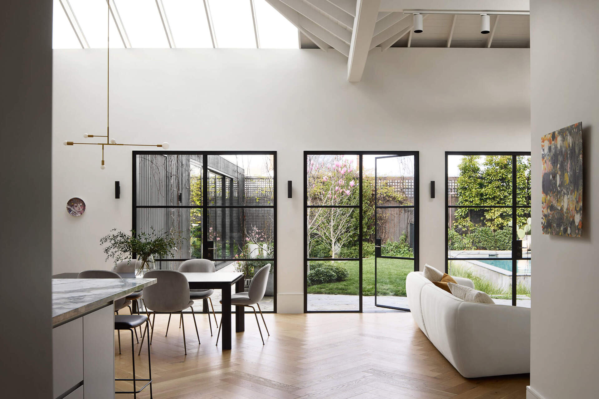Open-plan living and dining bring warmth and refinement to this Australian family home.