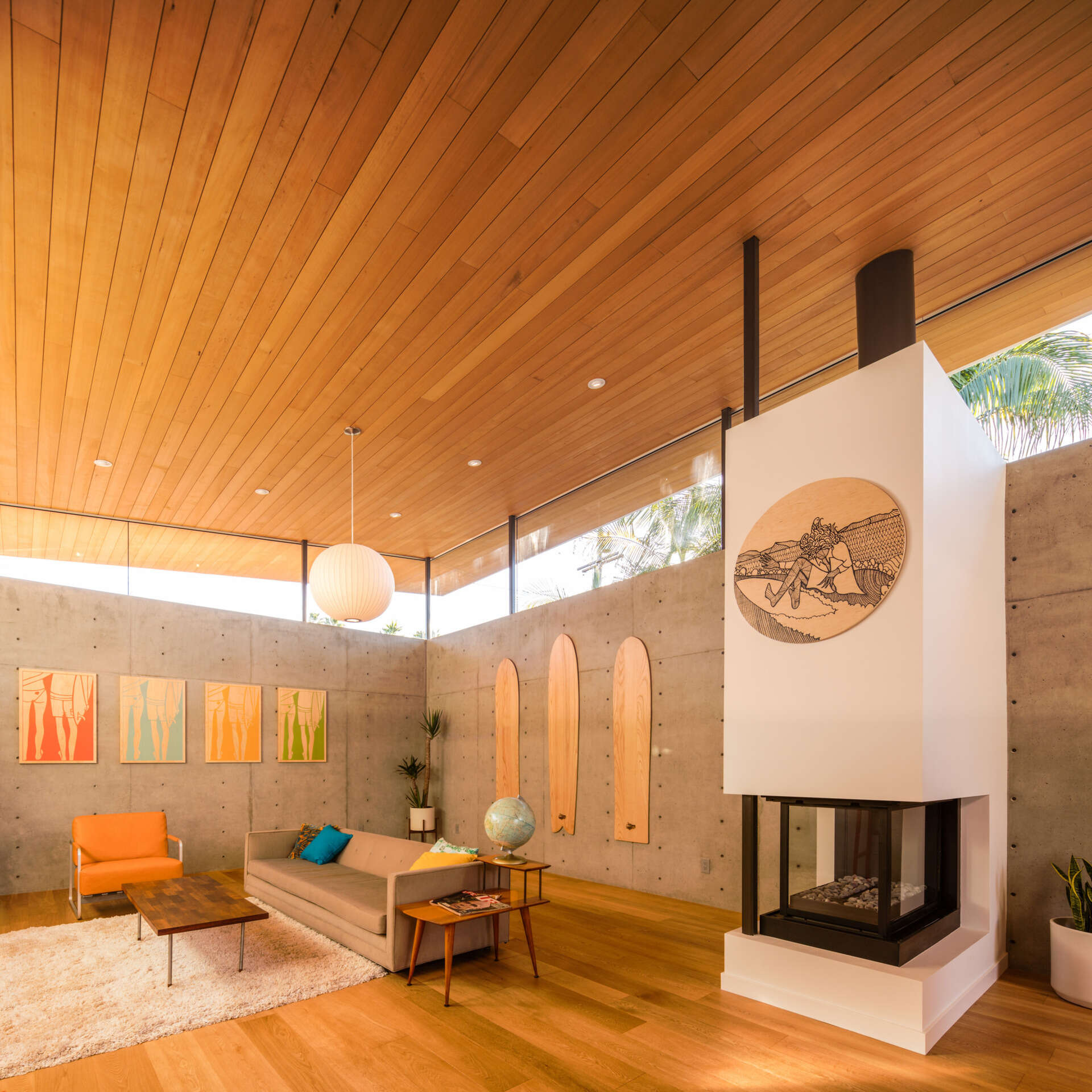 Concrete walls and wood ceilings balance modern warmth with retro charm.