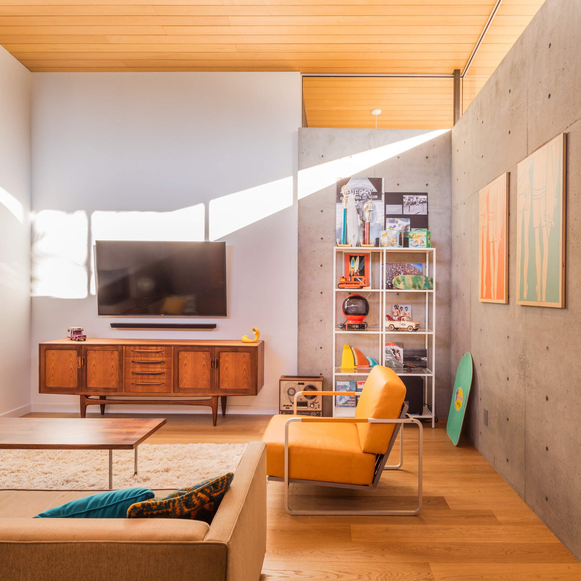 Concrete walls and wood ceilings balance modern warmth with retro charm.