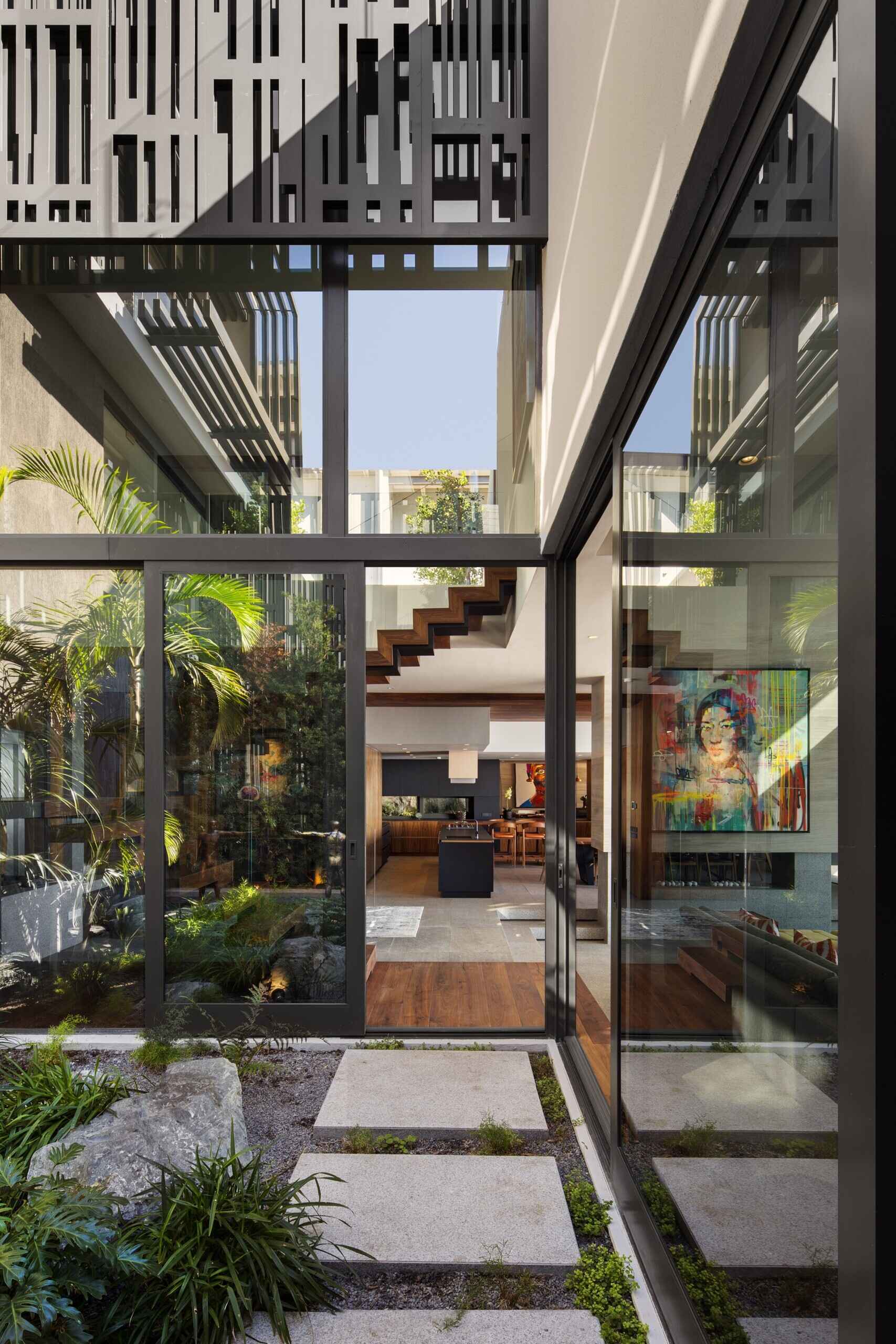 Small private courtyard with garden and water feature offers a serene retreat off the kitchen.