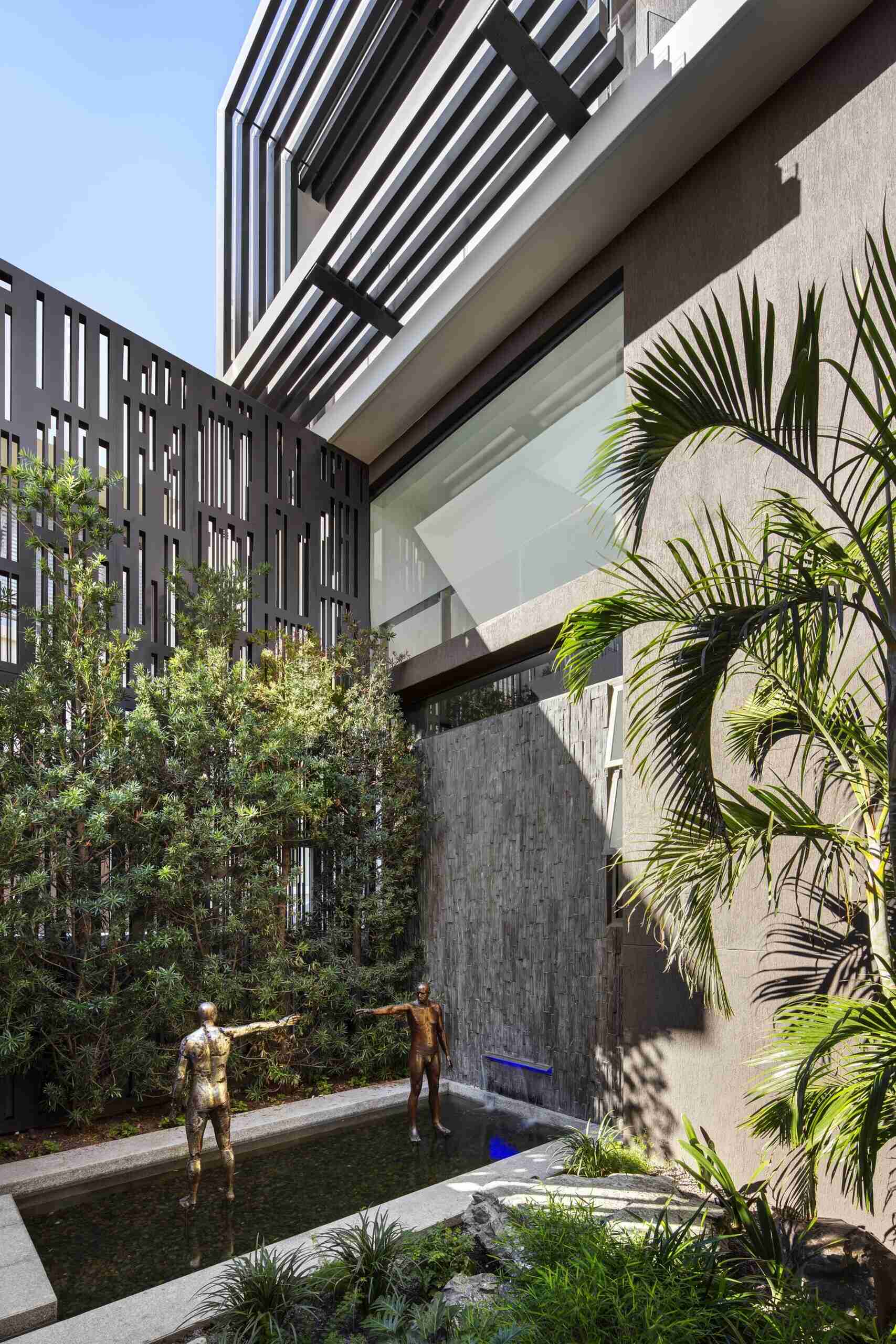 Small private courtyard with garden and water feature offers a serene retreat off the kitchen.
