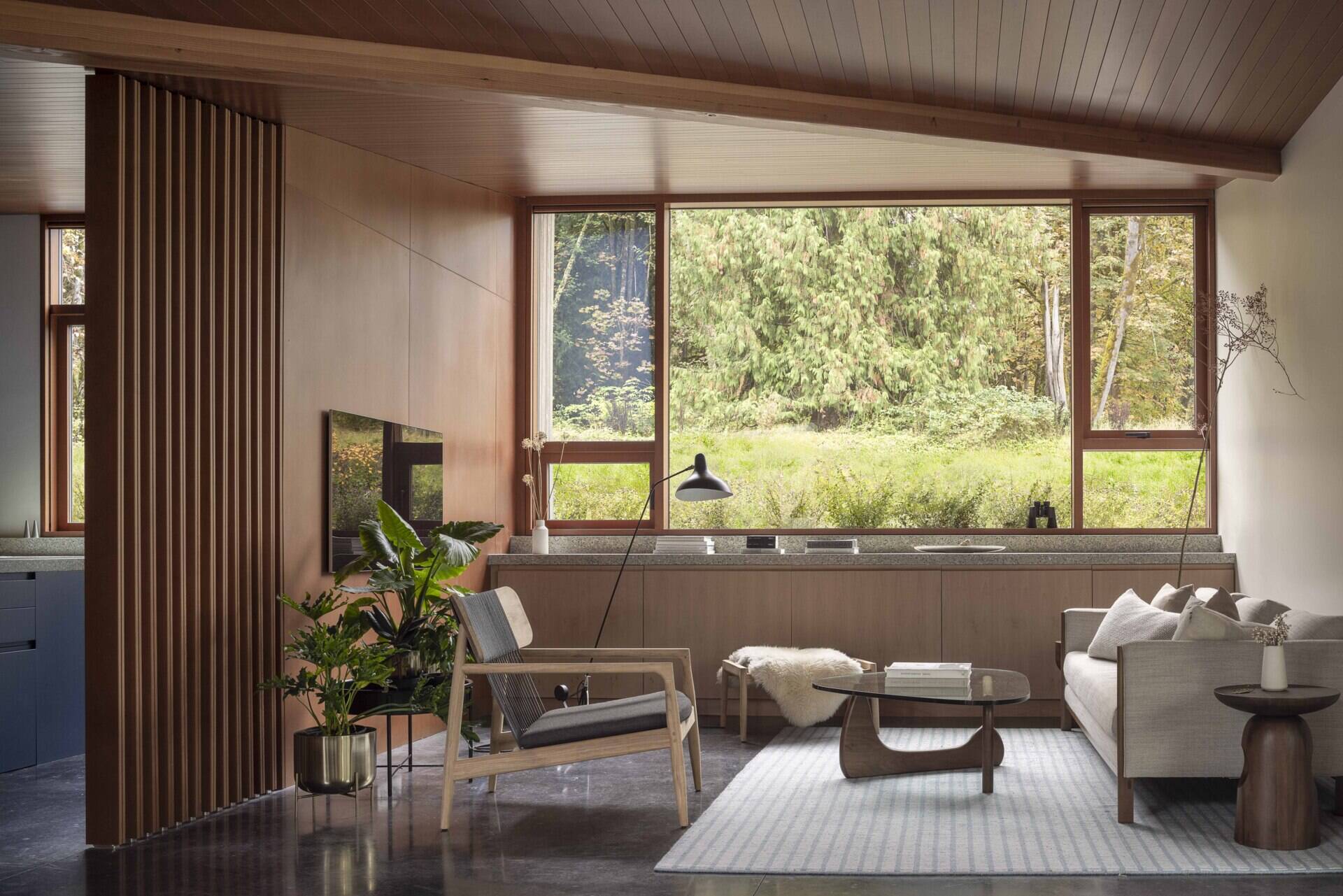 Inside, natural materials and handmade details tell a personal story. Locally sourced fir and cedar, terrazzo, and radiant concrete floors create a warm, practical backdrop for art, craft, and quiet reflection.