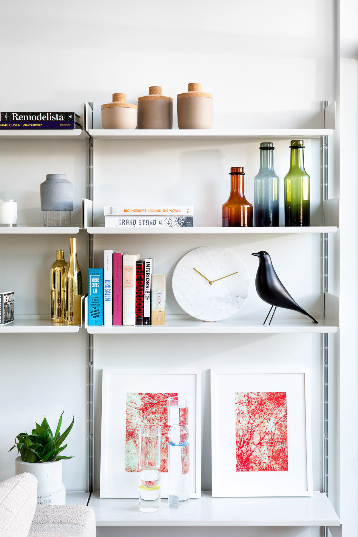 White metal shelving adds an industrial touch to this modern loft.