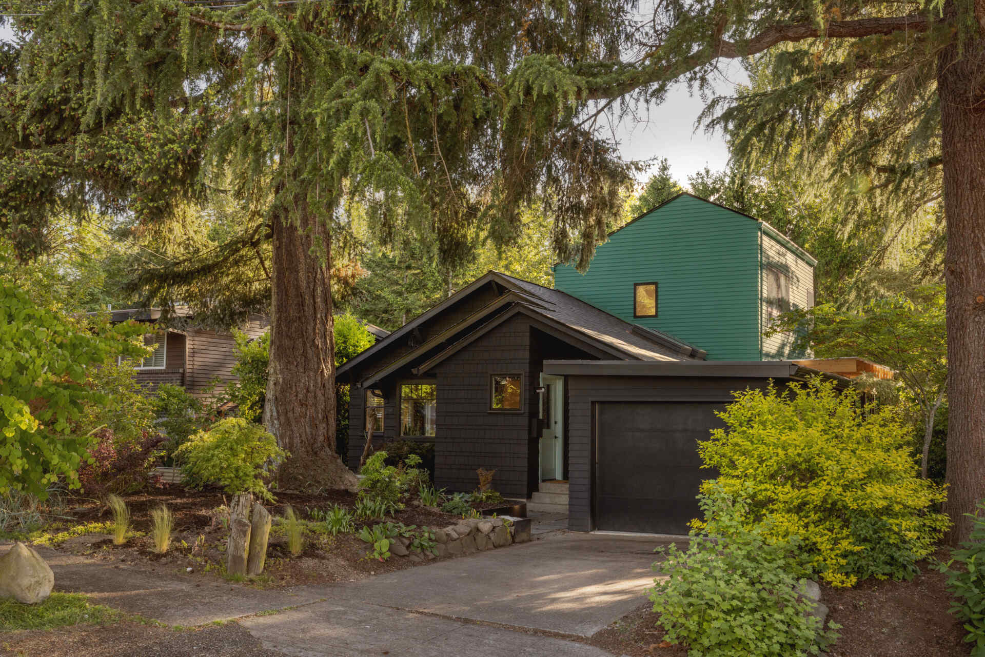 See how a bright teal addition transformed the street view of this 1919 Seattle home while preserving its historic layers.