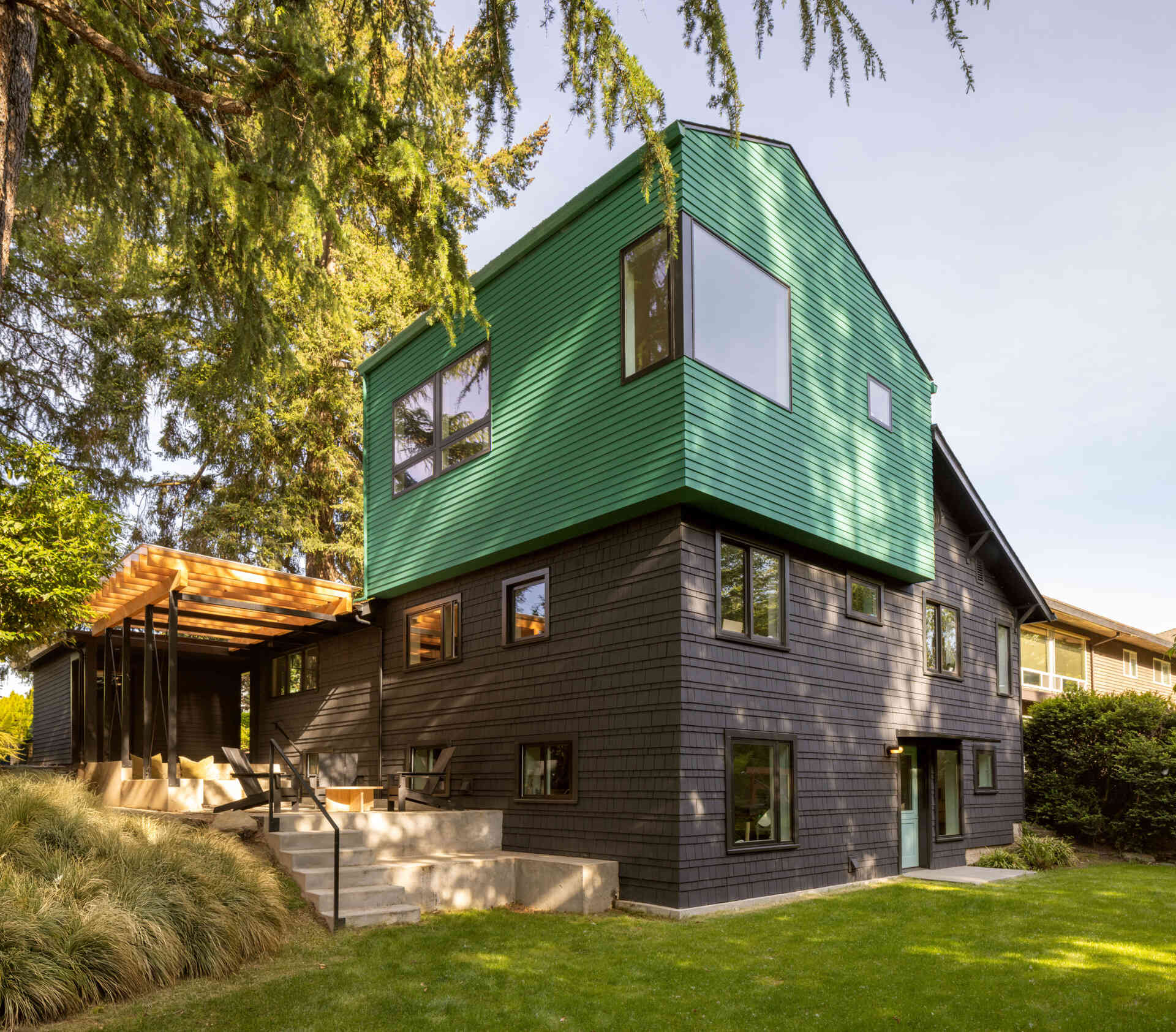 See how a bright teal addition transformed the street view of this 1919 Seattle home while preserving its historic layers.