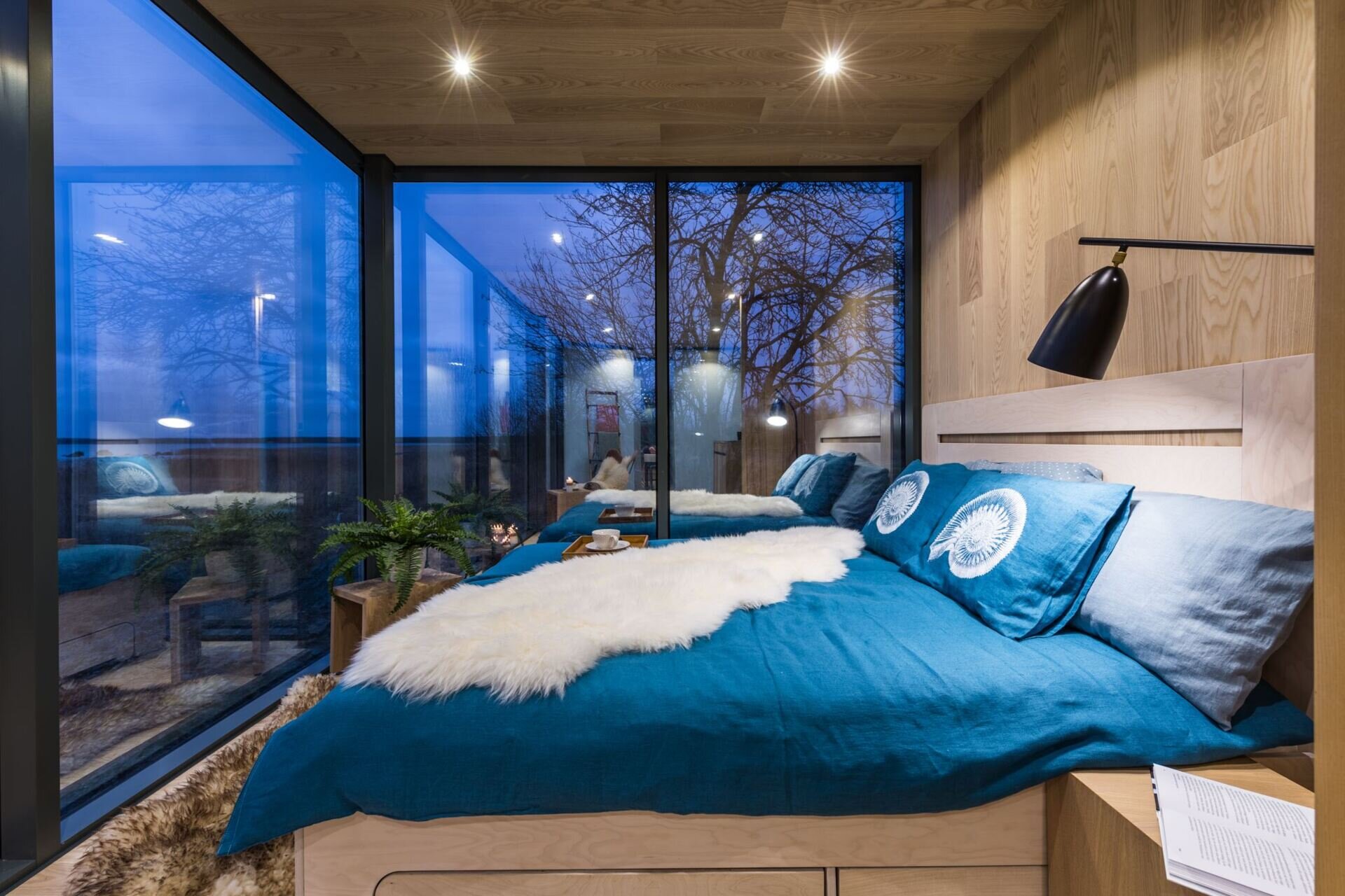 ÖÖD Houses are modular, prefabricated cabins blending Nordic design, mirrored glass, and clever interiors for compact, stylish living in nature.