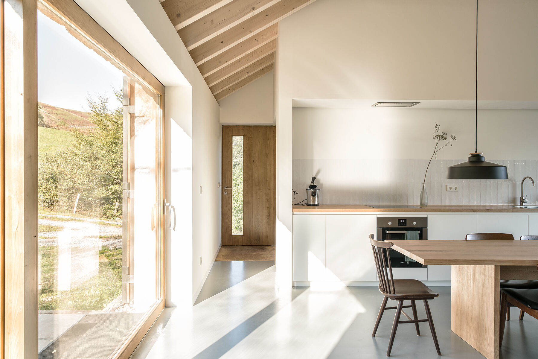 Warm wood, a fireplace, and minimalist decor make Villa Slow a place made for quiet moments.