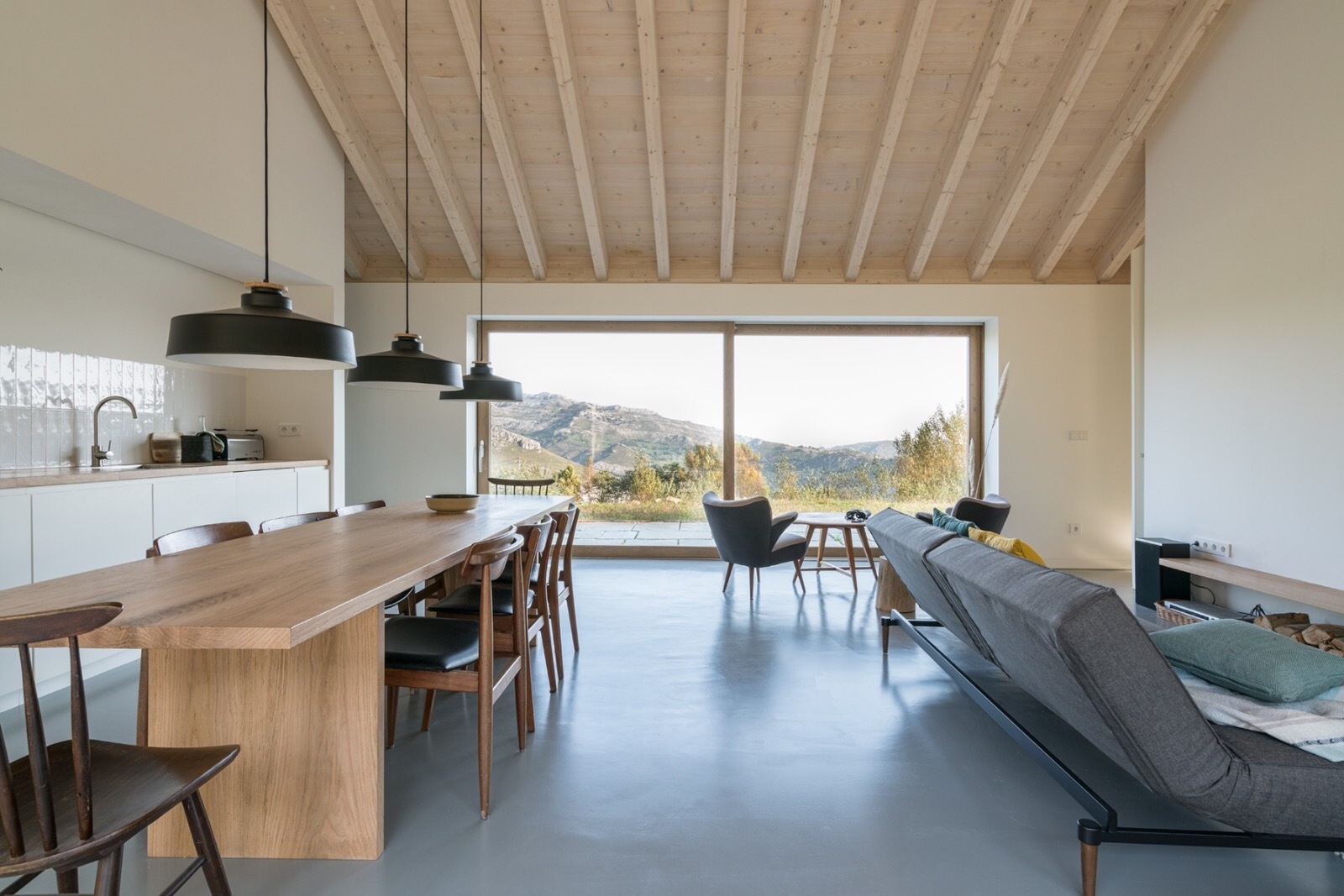Warm wood, a fireplace, and minimalist decor make Villa Slow a place made for quiet moments.