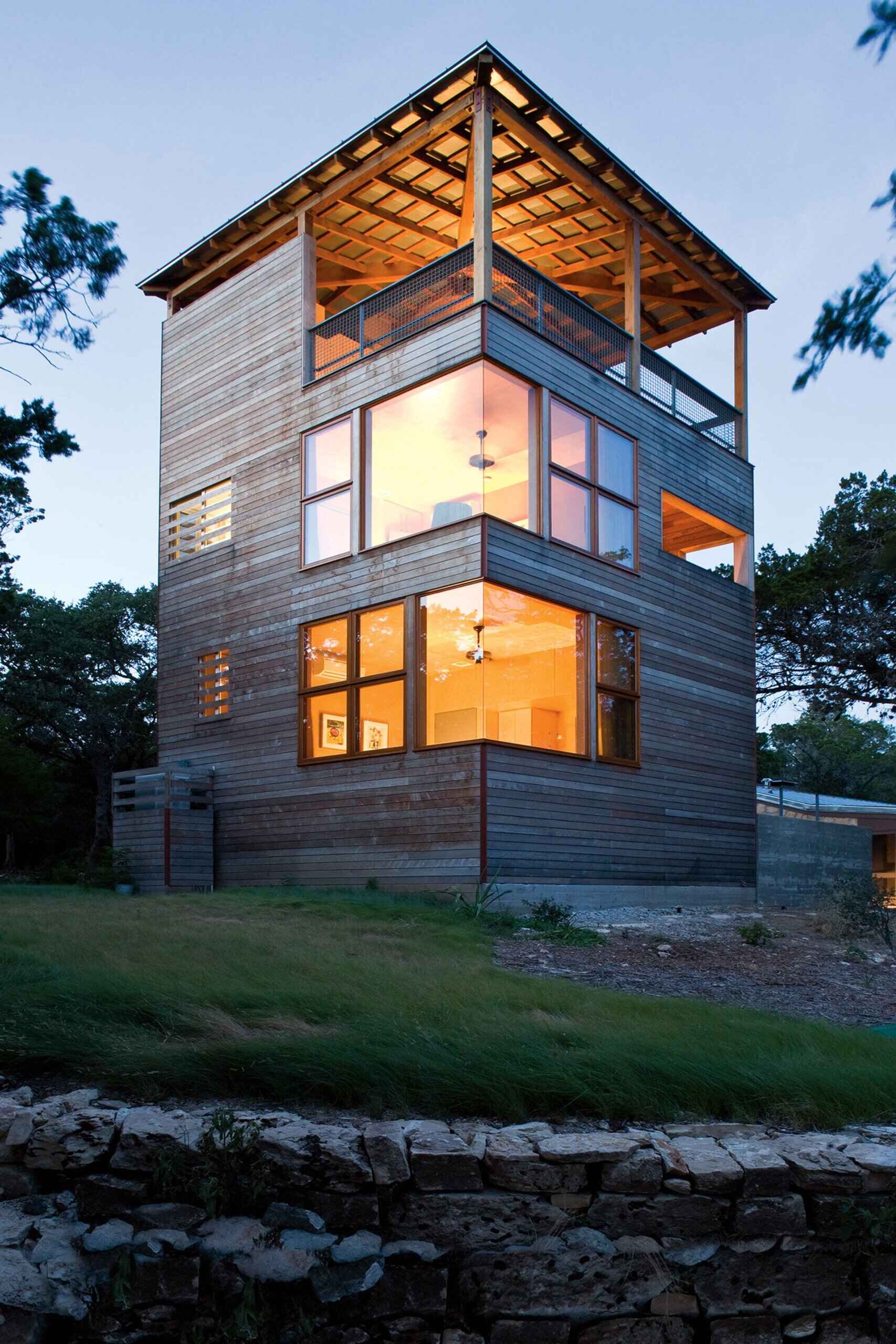 Inspired by the layers of a log, the Tower House blends natural materials and thoughtful design to rise gracefully above the forest.