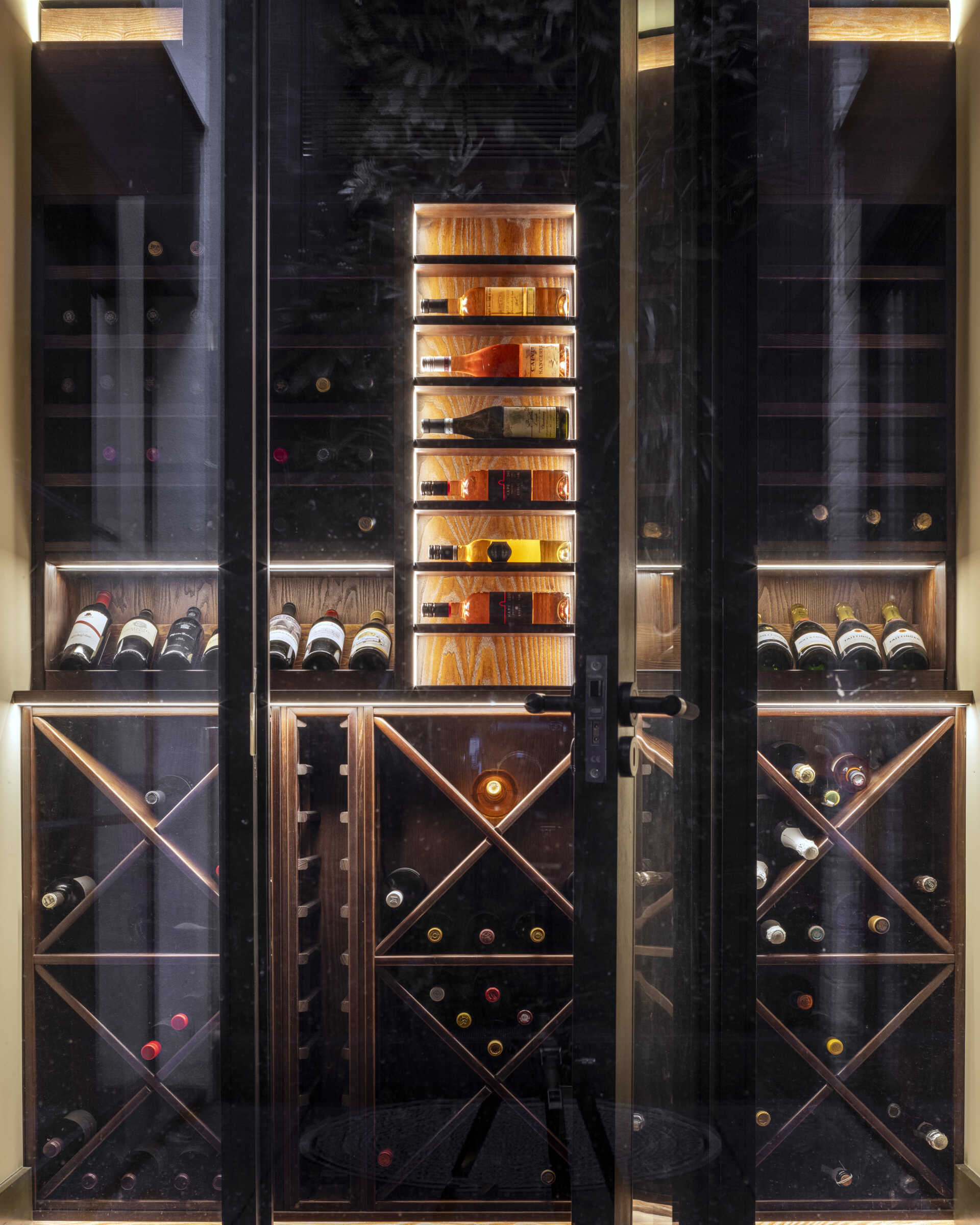 A discreet wine cellar adds an element of quiet luxury. It’s one of several thoughtful features that make the home perfect for hosting and entertaining.