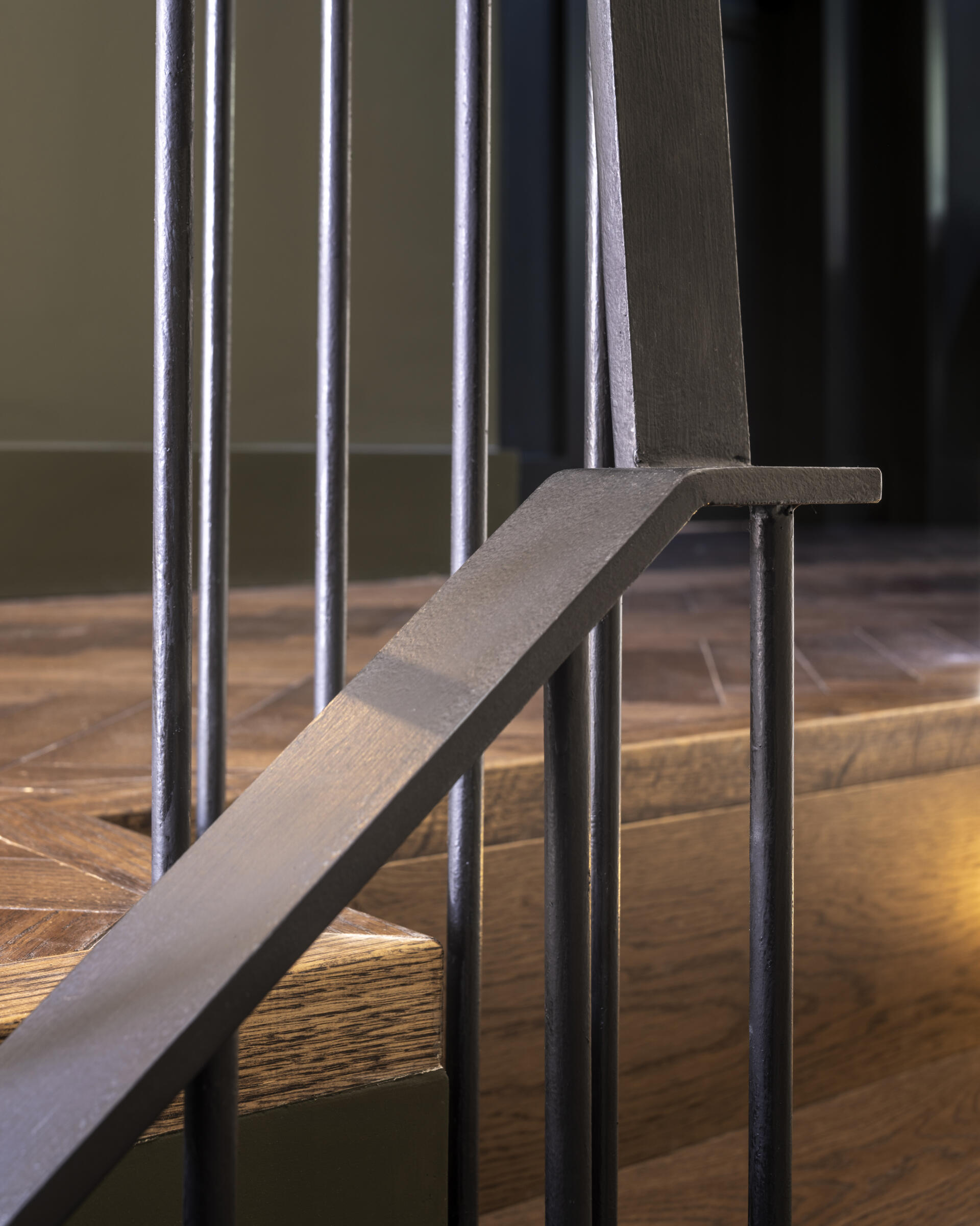 The new staircase acts as a centerpiece, connecting all four levels with grace. It introduces vertical sightlines that carry the eye through the house, reinforcing the feeling of openness.