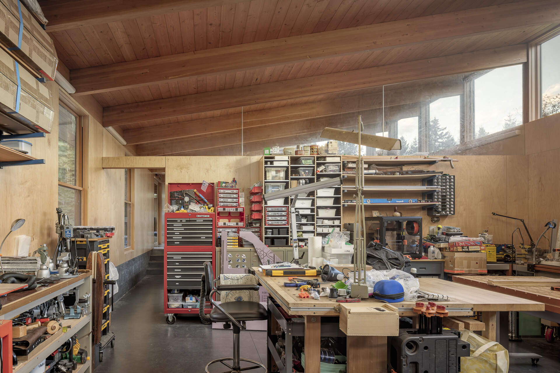 Linked by sheltered walkways, the woodworking and glass studios are flooded with north light from clerestory windows. Every workspace connects back to the garden courtyard, making creativity and craft a natural part of daily life.