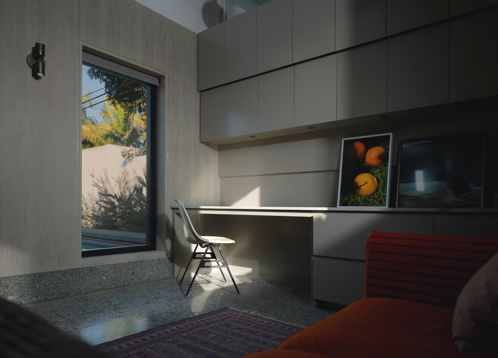 Walnut wall panels and handcrafted details define the living space, merging artistry and architecture in one quietly expressive room.