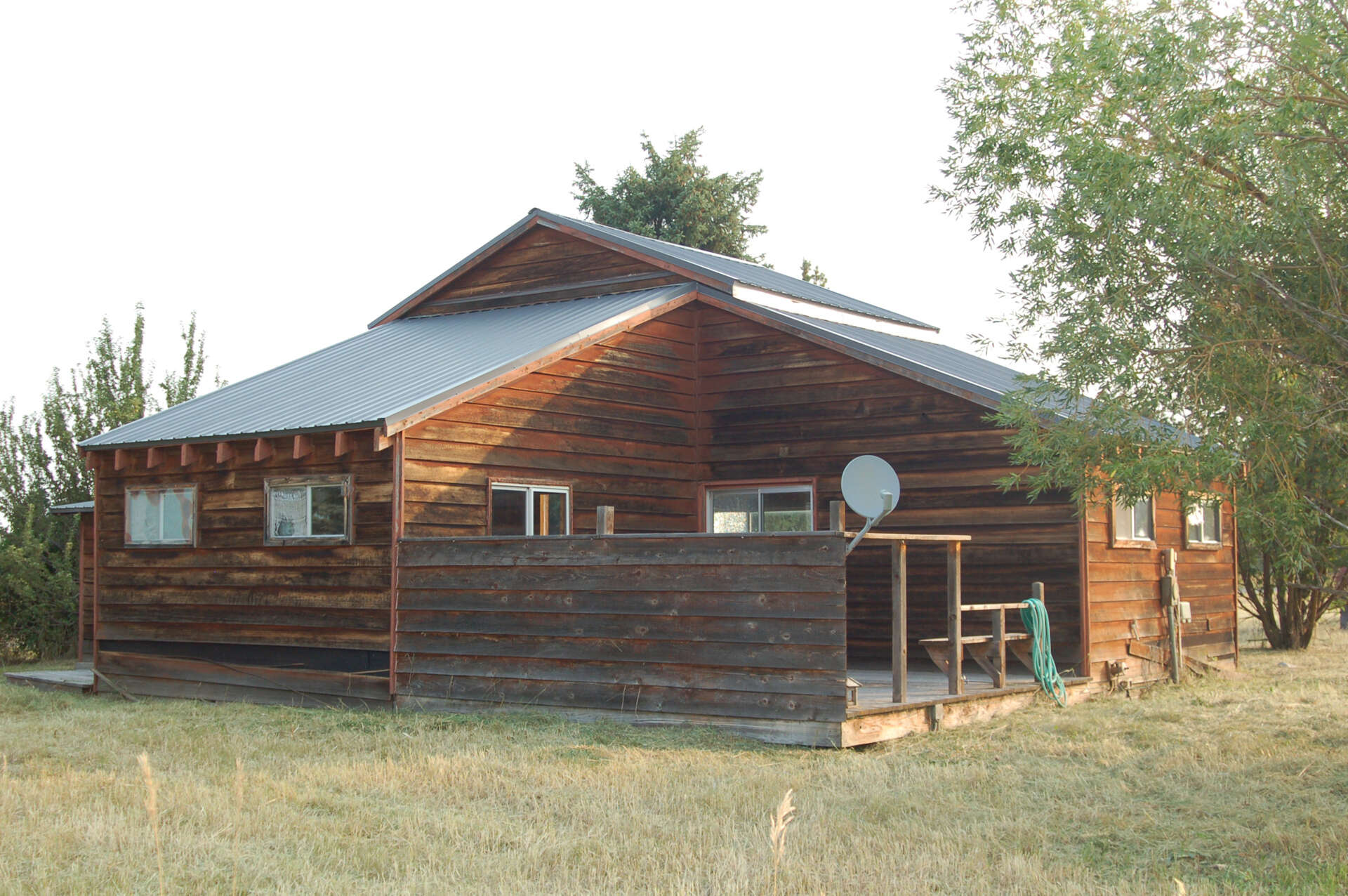 A once-dilapidated mountain cabin with charm and potential, sitting quietly on a three-acre property, waiting for a thoughtful transformation.