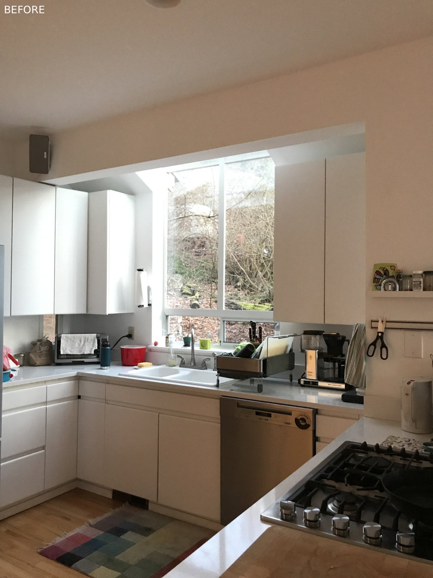 BEFORE - The kitchen saw the greatest transformation. SHED removed a small den near the entry and added a bump out, creating a larger, fully functioning center for family life. Caesarstone Pebble counters and Fireclay Neptune tile define the workspace, while its open links to the living and dining areas finally give the home the circulation it lacked.