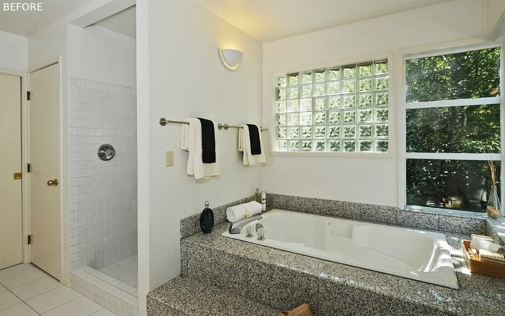 BEFORE - In the primary bath, Fireclay Hood River Gloss tile wraps the walls while Daltile Outlander Marine tile grounds the floor. Privacy glass, mirrors, and full height detailing emphasize height and brightness.