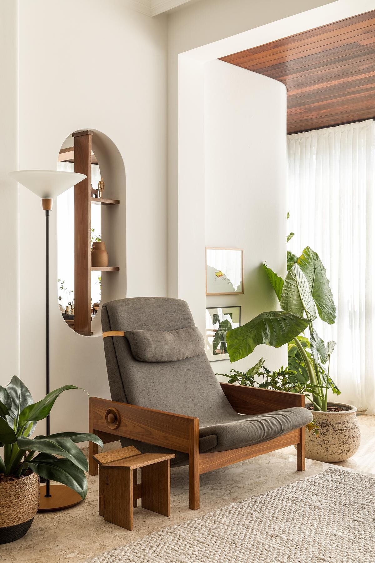 This former balcony was transformed into a dedicated seating area with travertine flooring.