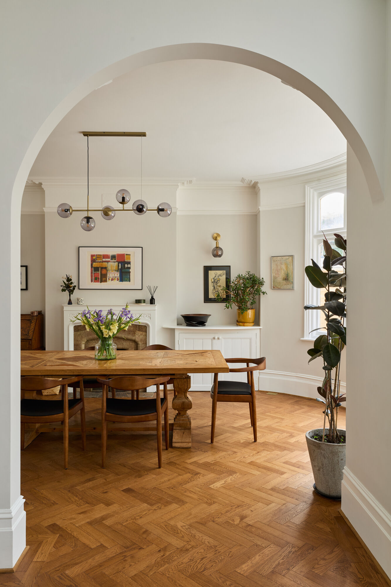 A archway connects this dining room to the new kitchen.