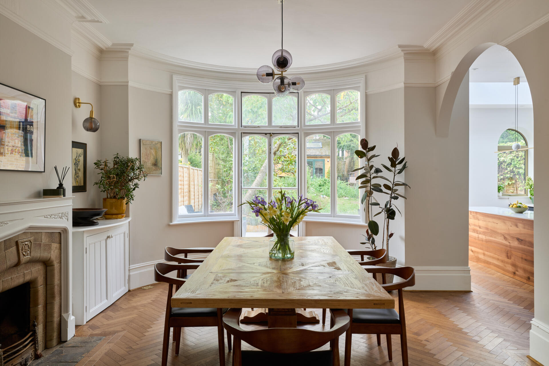 A archway connects this dining room to the new kitchen.