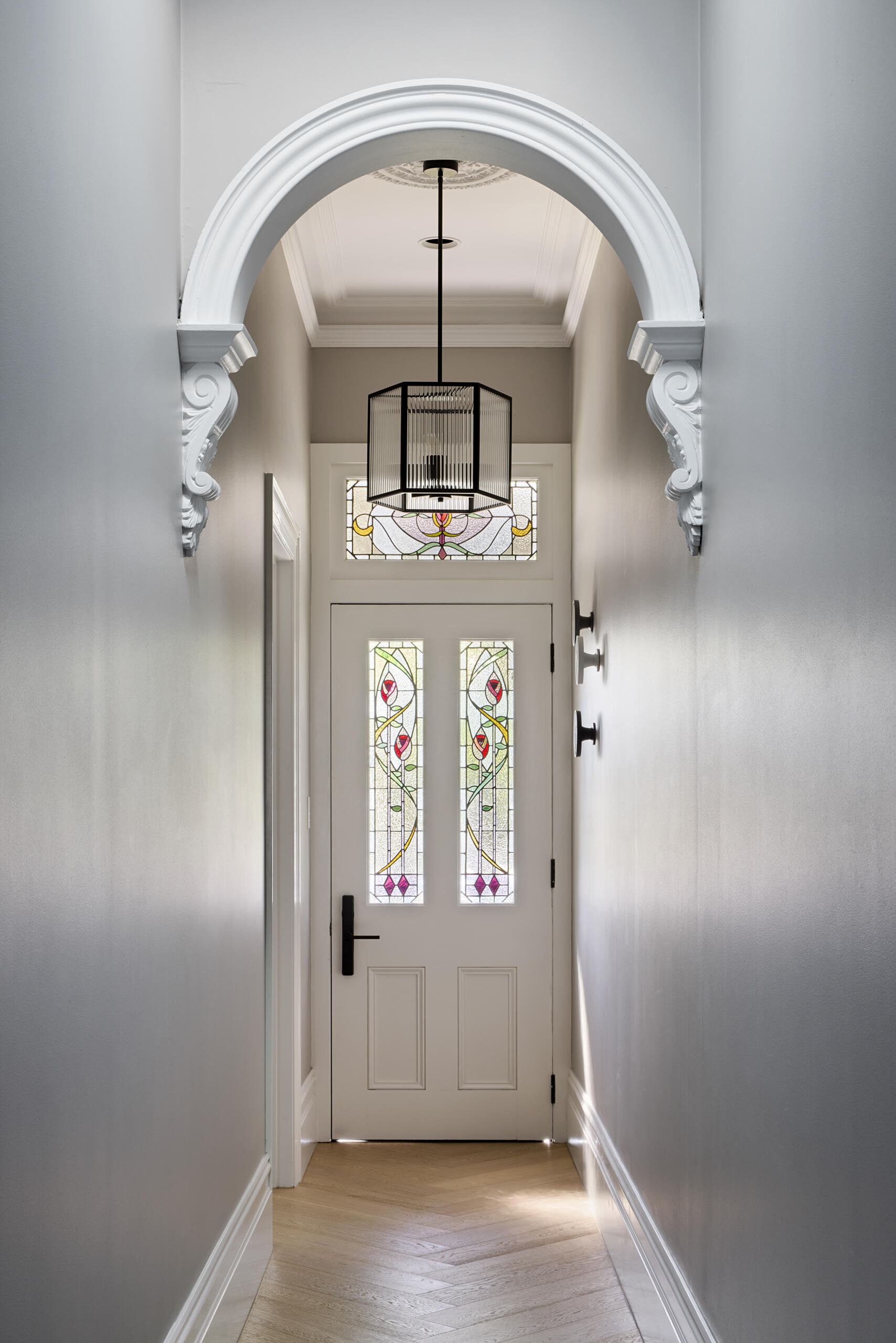 A front door with stained glass windows.