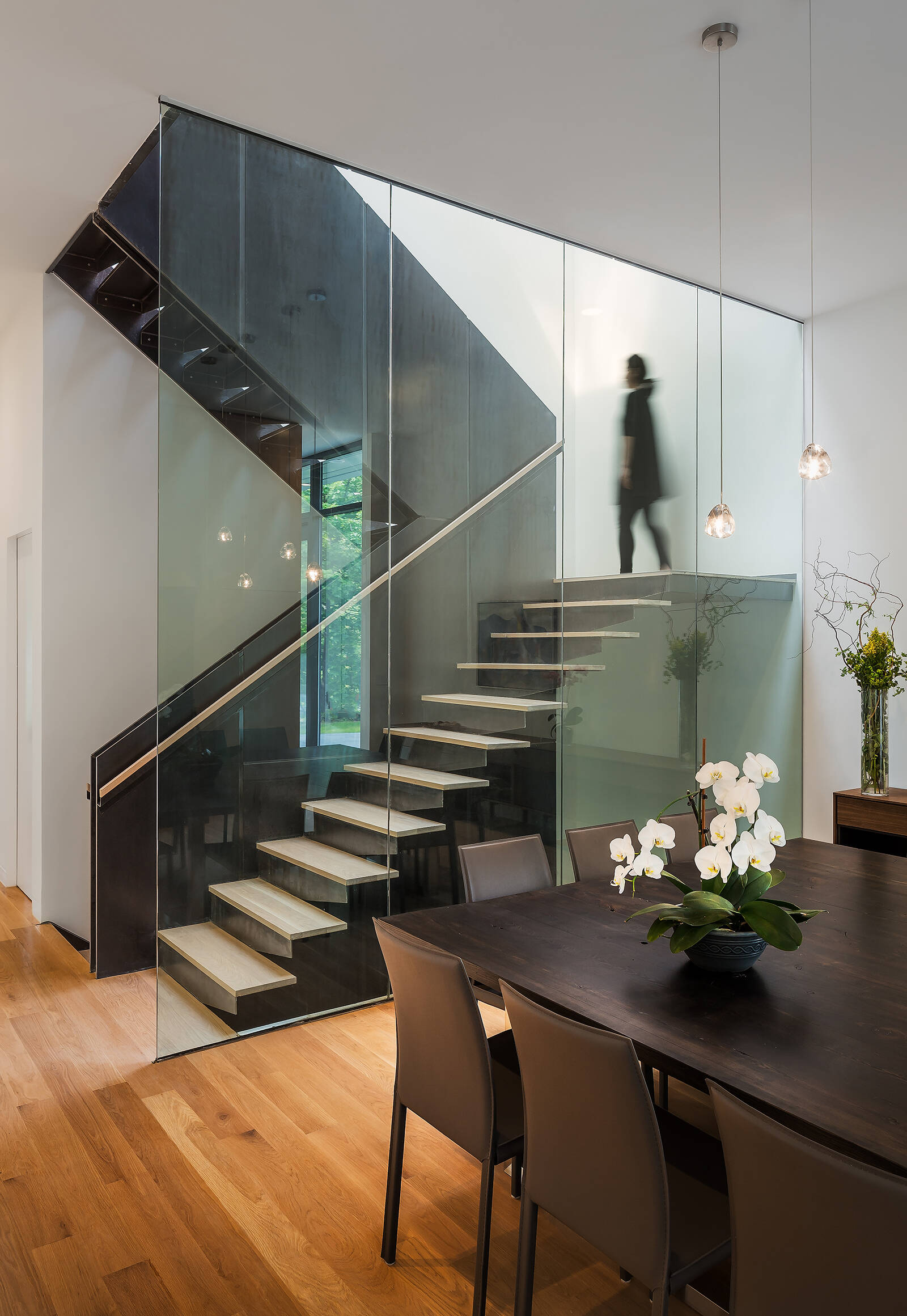 A staircase crafted from wood and hot-rolled steel ties the home together, both structurally and visually.