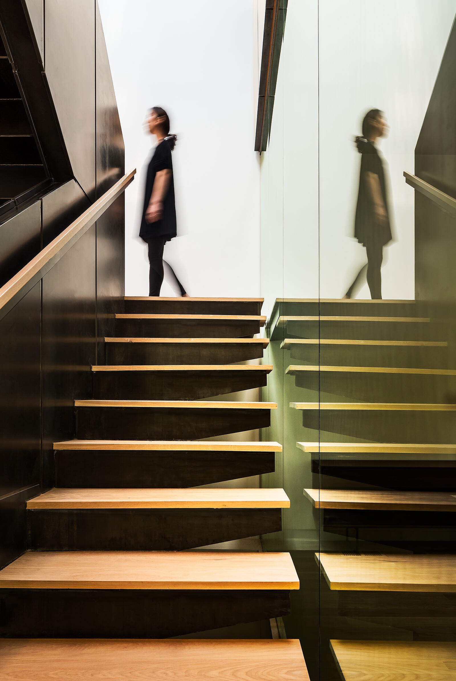 A staircase crafted from wood and hot-rolled steel ties the home together, both structurally and visually.
