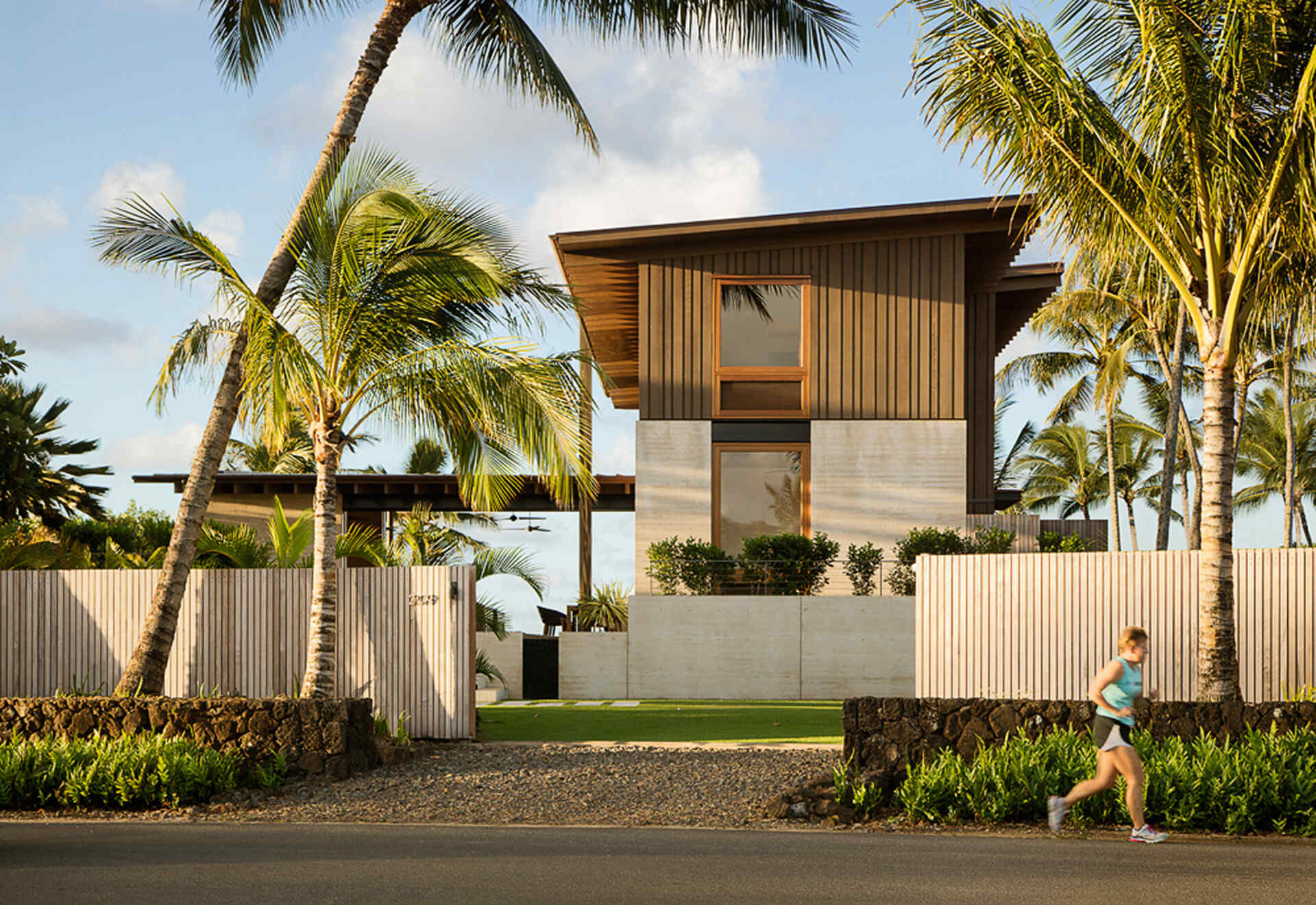 A serene Kauai home that opens like a butterfly, balancing privacy and oceanfront living in effortless harmony.