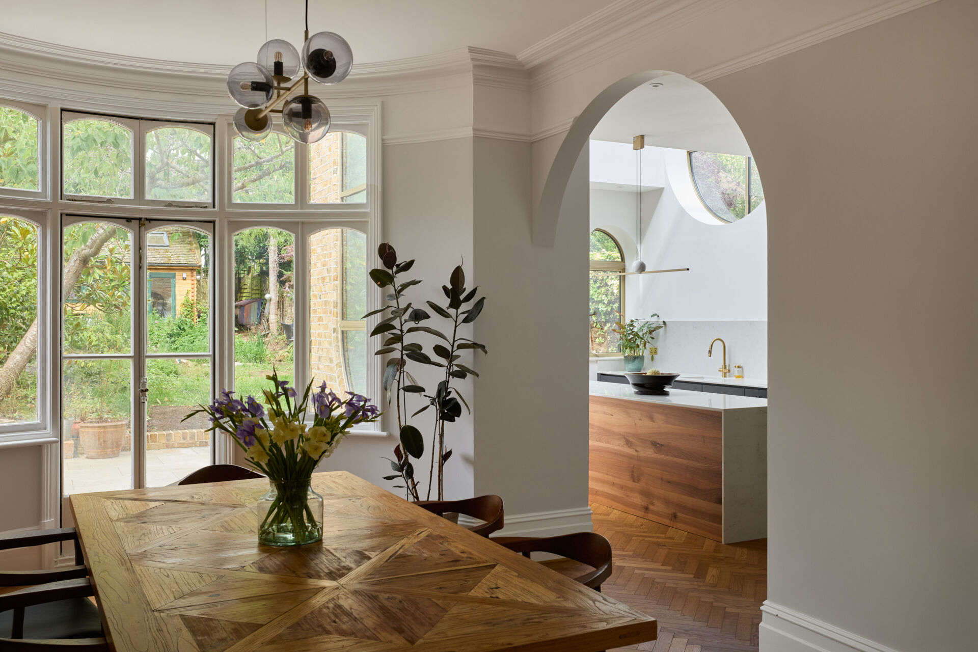 Glazed French doors framed connect this dining room to the garden.