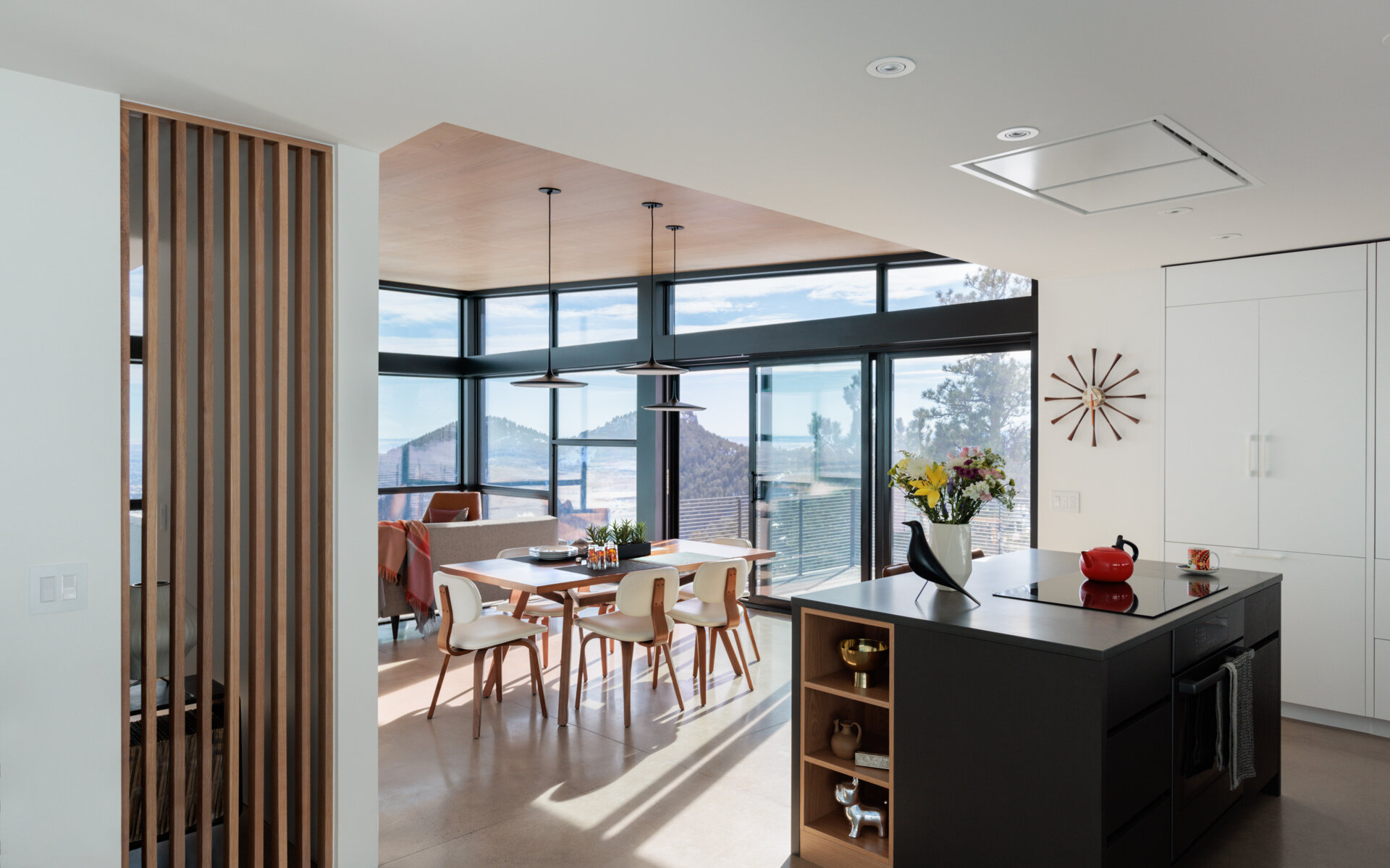 An airy dining space designed to capture changing daylight and open sightlines. Meals feel connected to the outdoors in a smooth, effortless way.