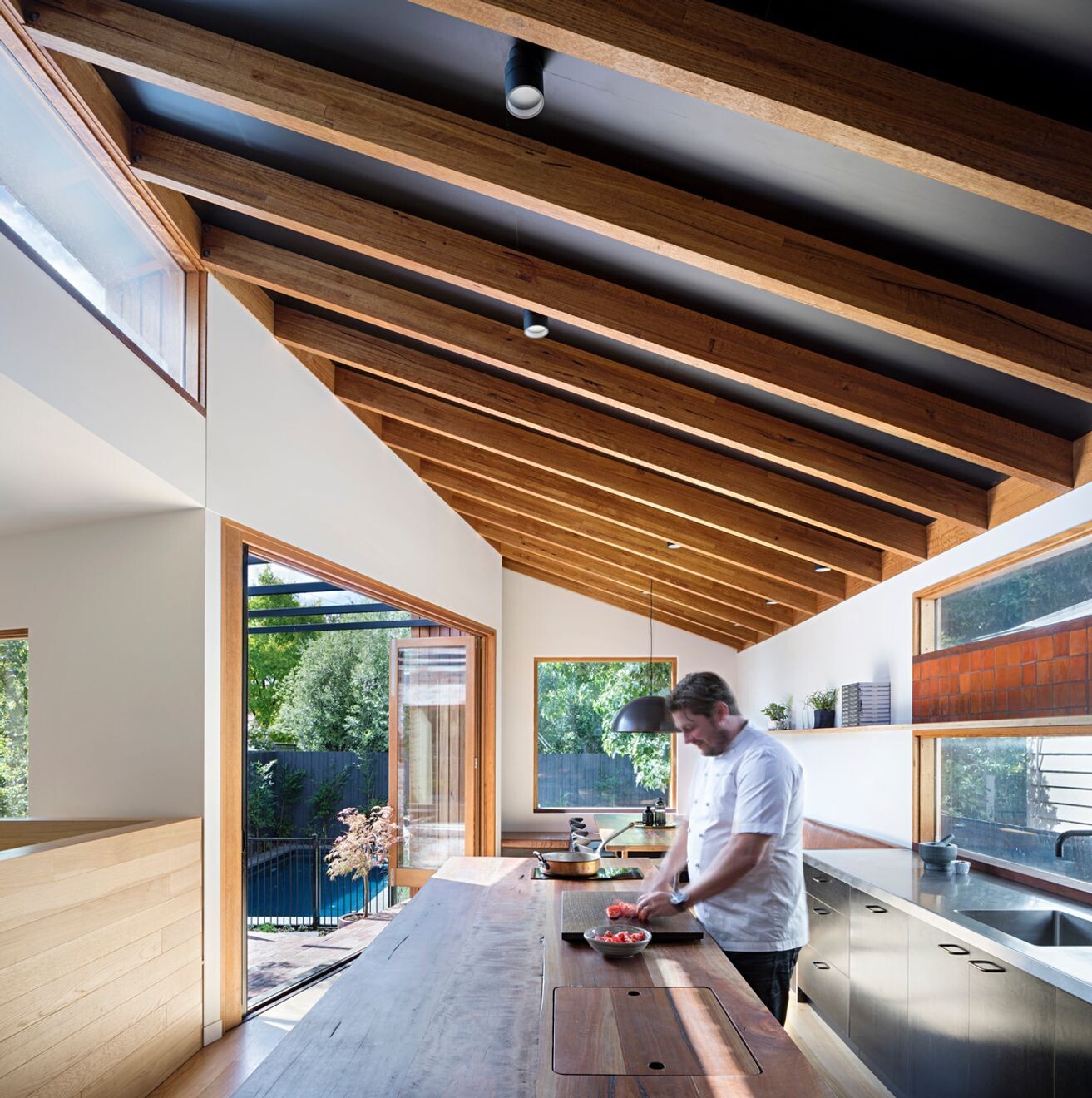The kitchen centres on a solid Spotted Gum island, designed for cooking, gathering and conversation with friends and family.