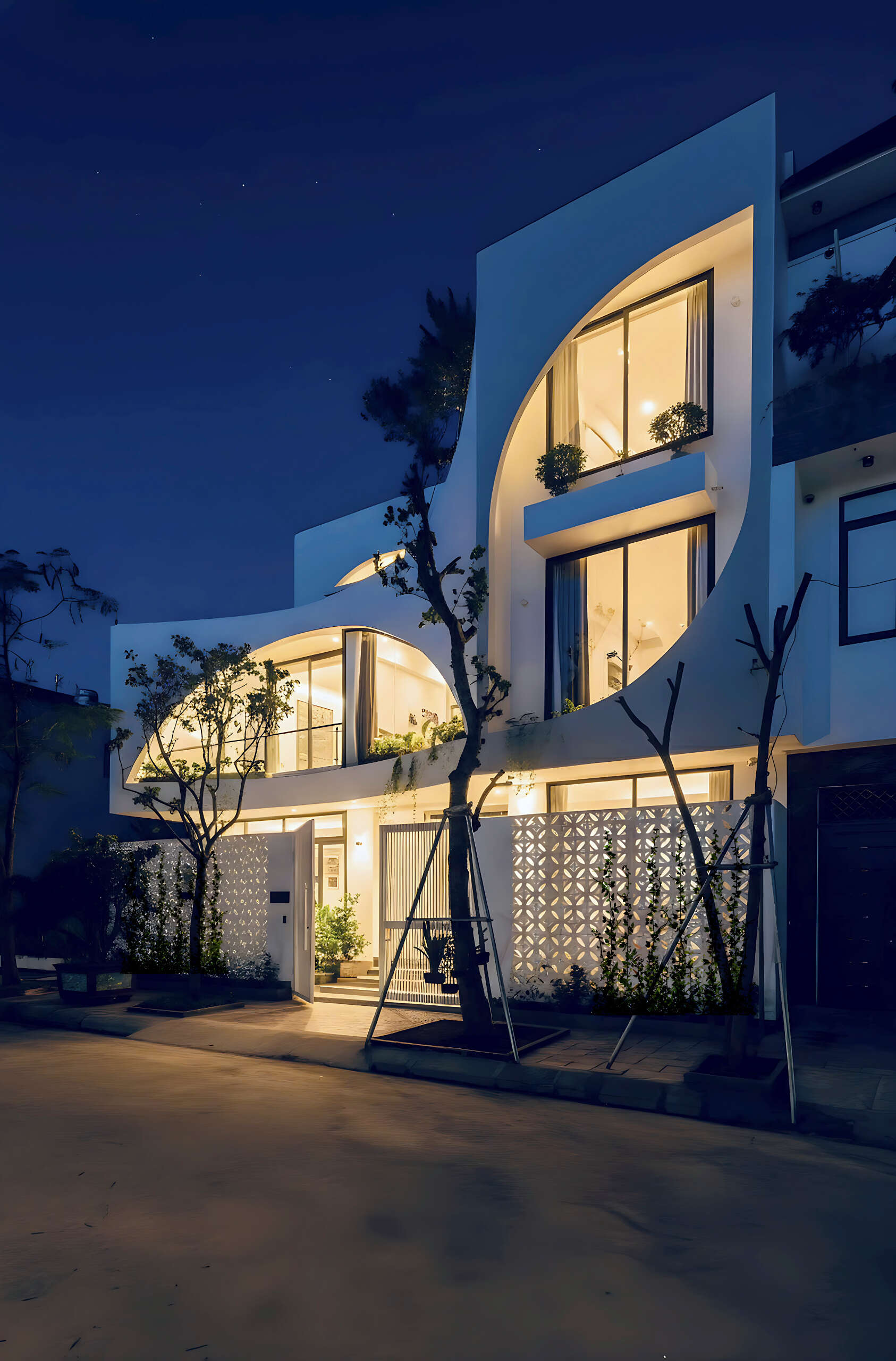 A modern home shaped with soft leaf inspired curves, creating a warm and emotional living space filled with natural light.