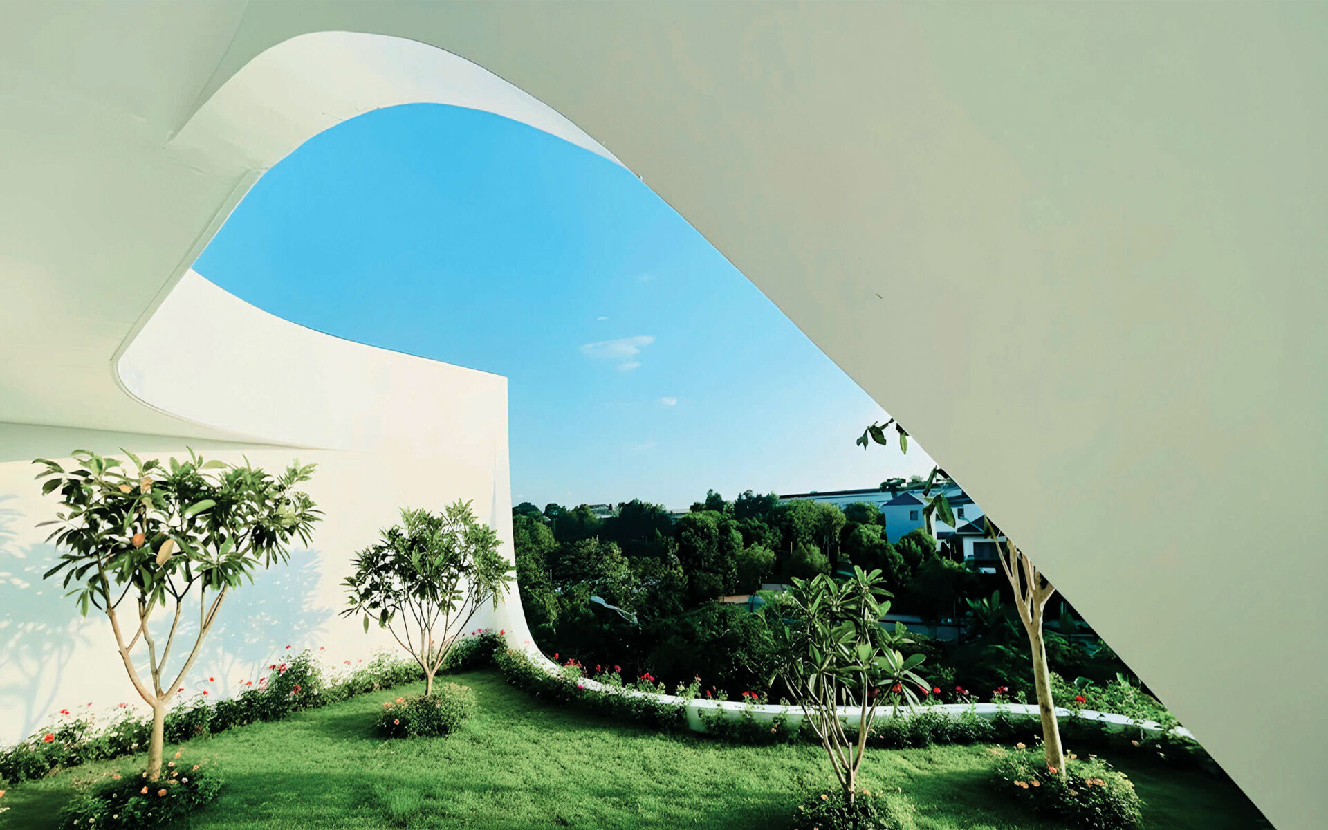 White volumes, curved cuts and filtered daylight create a facade that feels strong yet graceful, glowing softly at night.