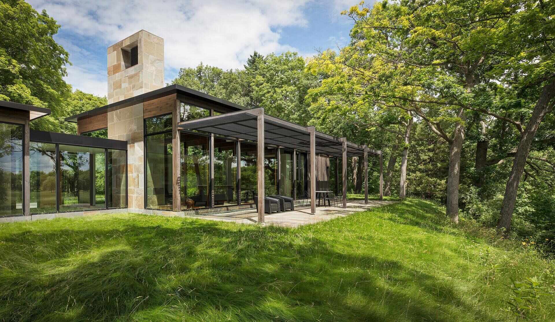 A covered patio overlooking trees and wetlands, perfect for quiet outdoor moments.