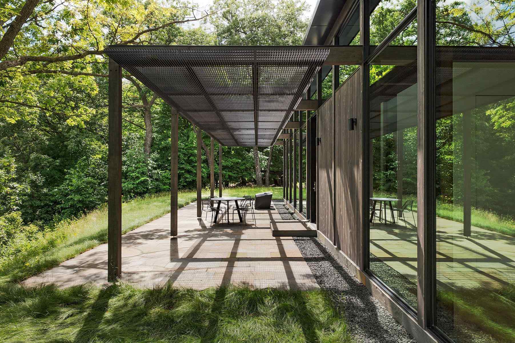 A covered patio overlooking trees and wetlands, perfect for quiet outdoor moments.