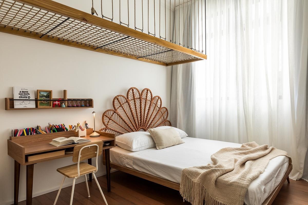 This child’s bedroom introduces a playful suspended zone above the bed for reading and play, creating a unique functional space that adds vertical interest without closing off space.