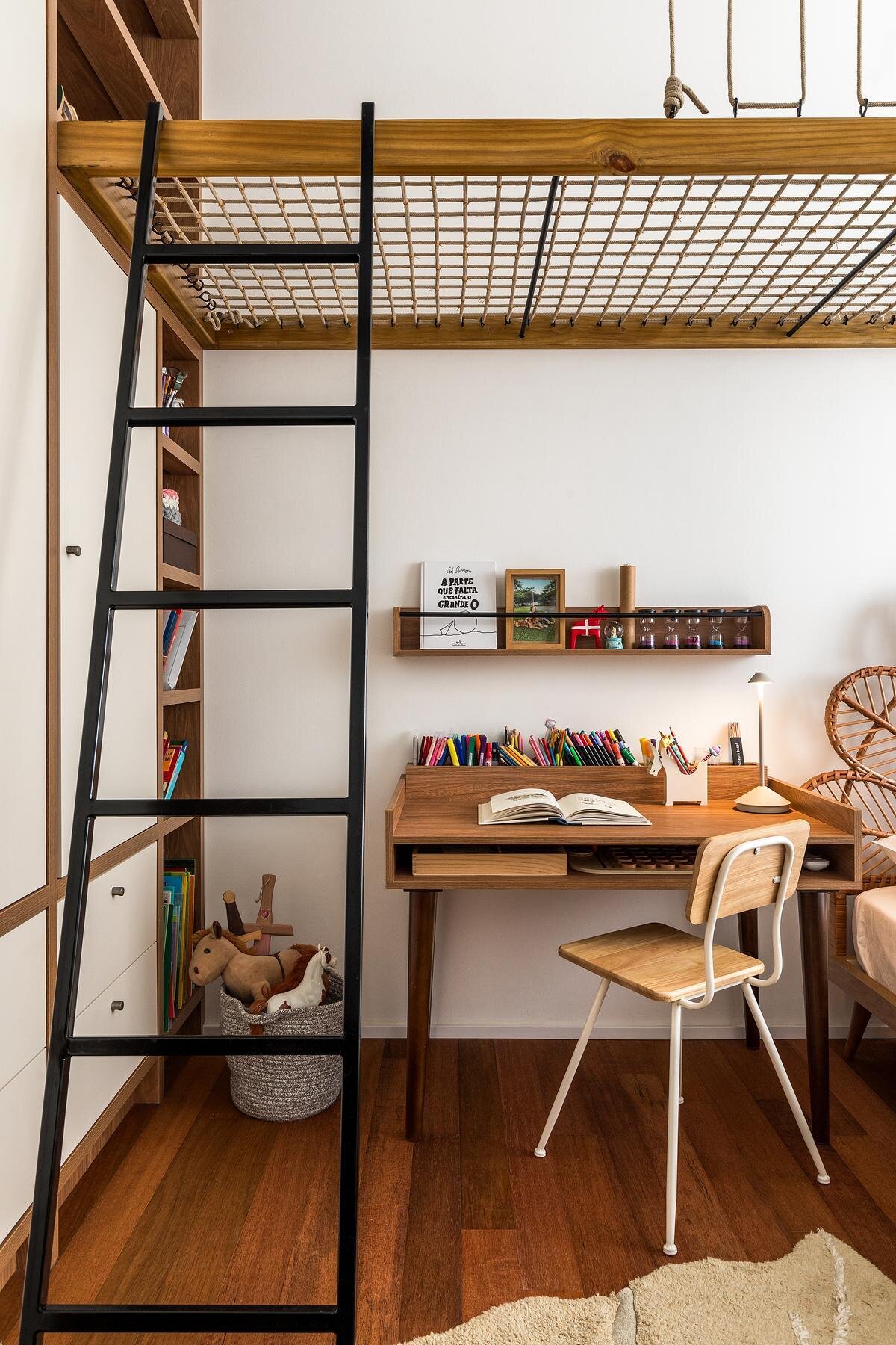 This child’s bedroom introduces a playful suspended zone above the bed for reading and play, creating a unique functional space that adds vertical interest without closing off space.