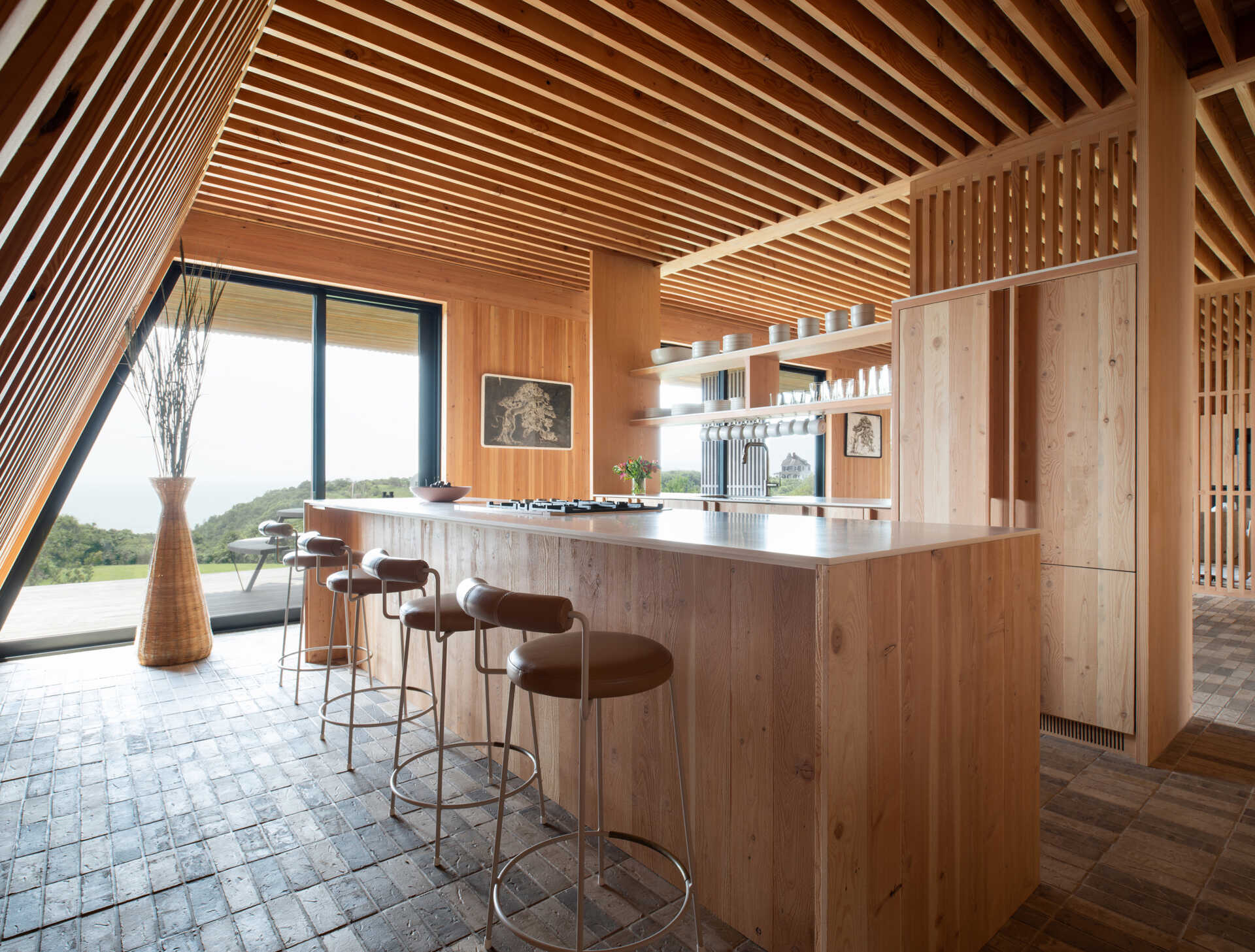 A stripped-back kitchen of open shelving and solid wood surfaces, blending function and natural beauty in perfect balance.