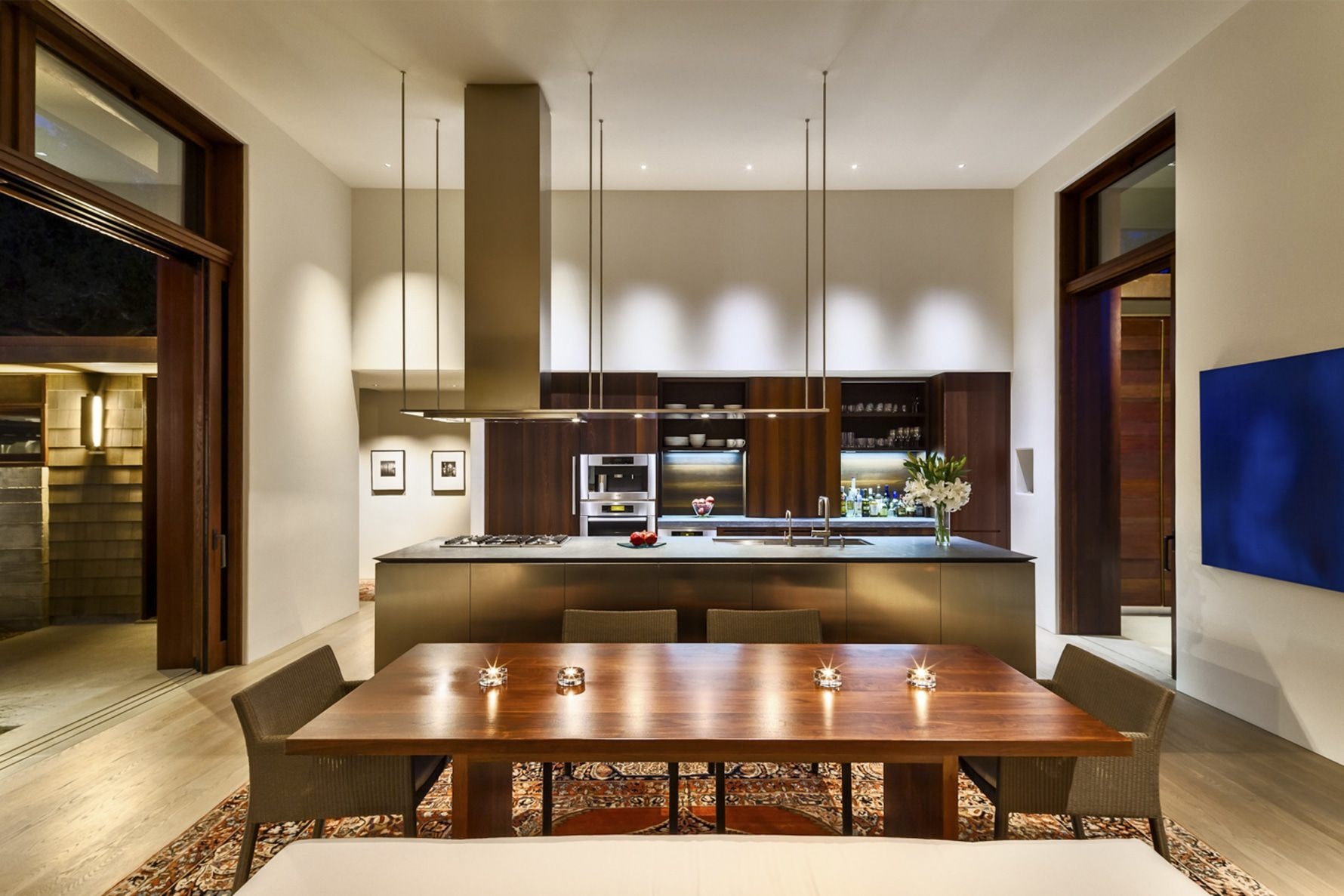 A minimalist Montecito kitchen with soapstone counters, wood cabinetry, and stainless details.