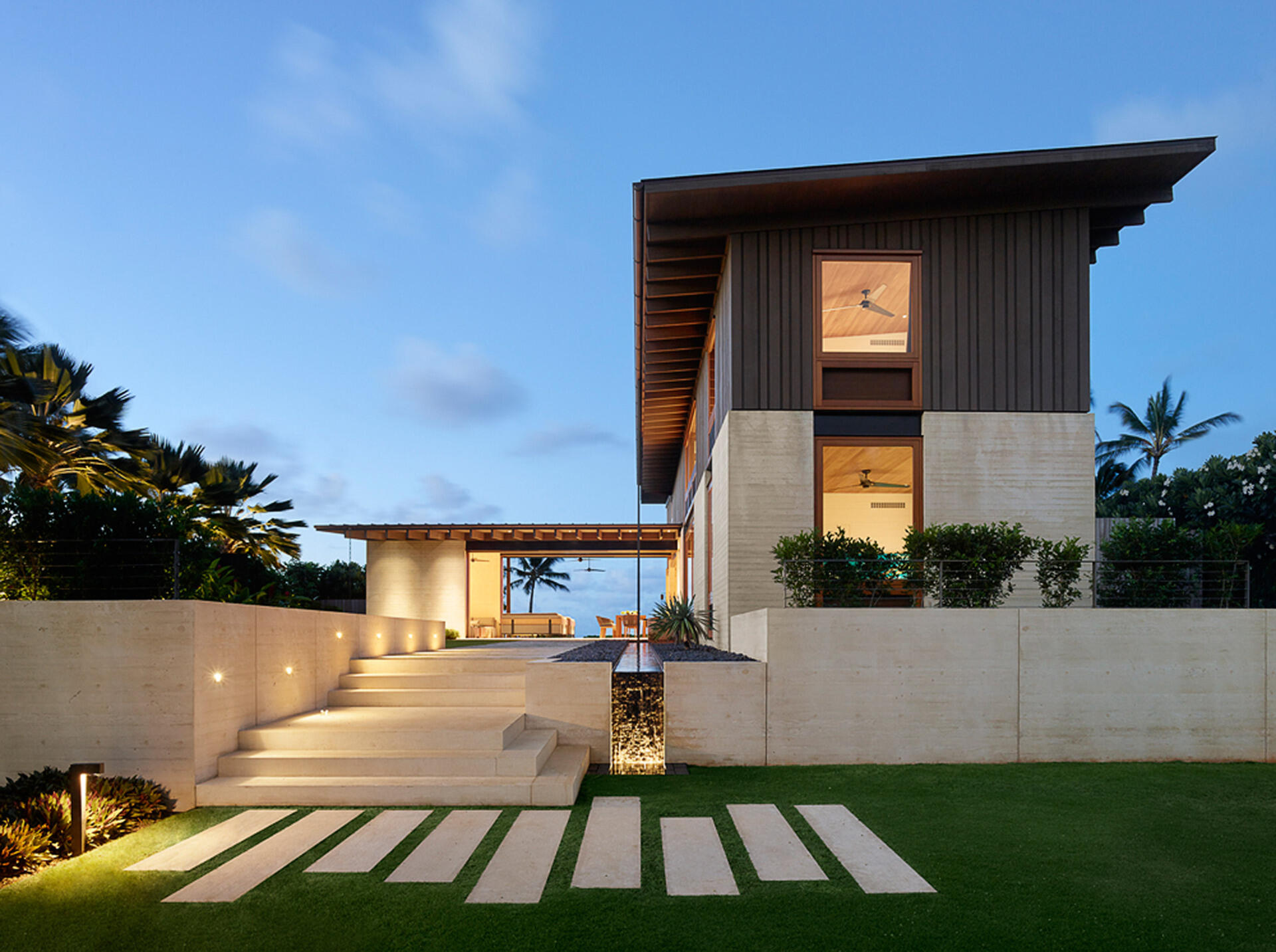 A serene Kauai home that opens like a butterfly, balancing privacy and oceanfront living in effortless harmony.