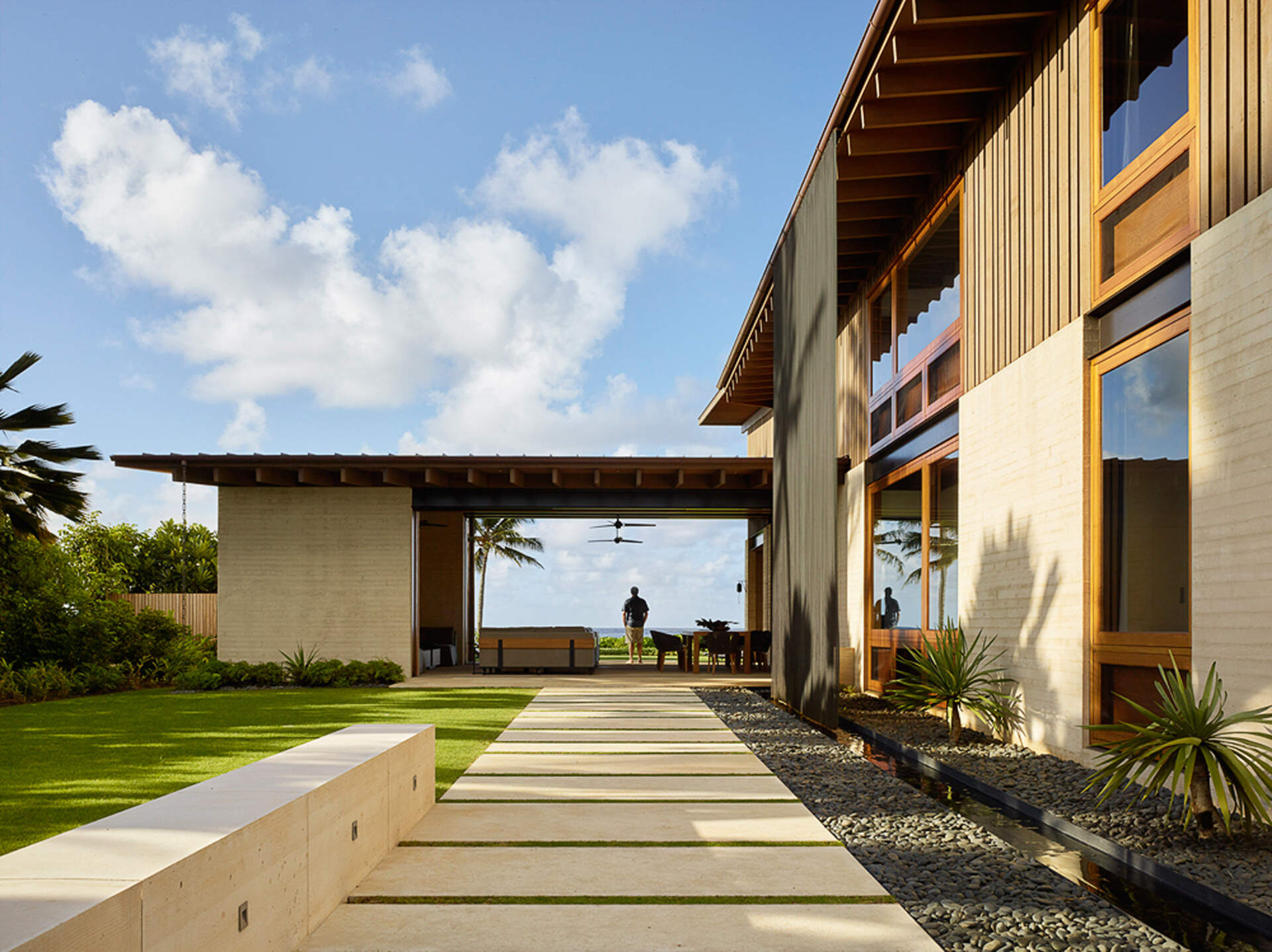 A clever copper rain curtain offers privacy, water management, and a touch of magic in this beachfront Kauai home.