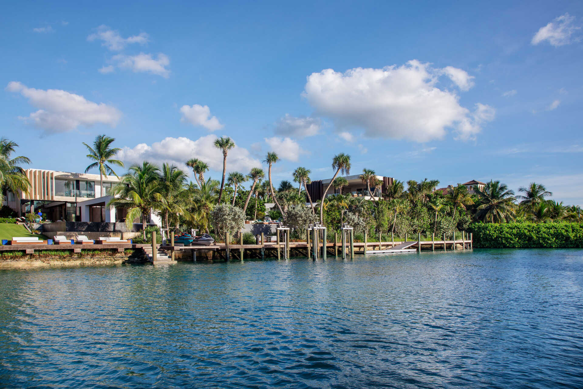 A calm Bahamian villa where coral stone, tropical gardens, and canal side views shape every room.
