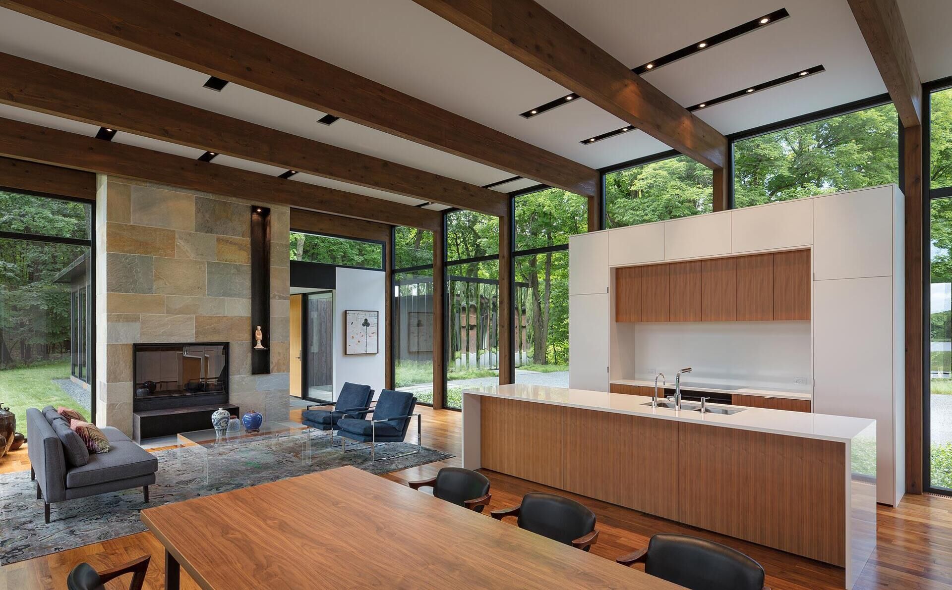 A soft mix of walnut, white walls and clean lined cabinetry in the kitchen.