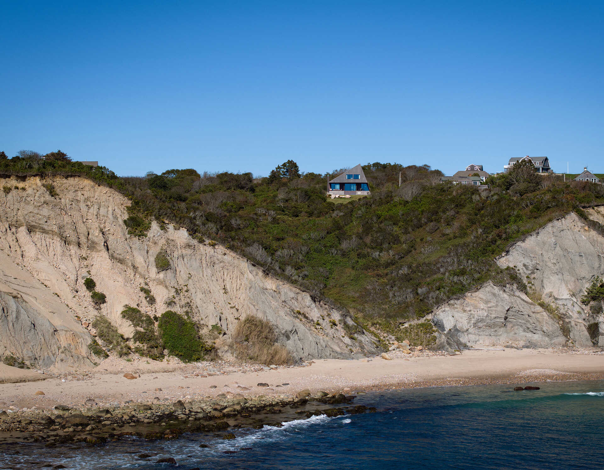 Crafted from cedar shakes, copper flashing, and hand-assembled timber, this coastal home proves that simple materials can create enduring architecture.
