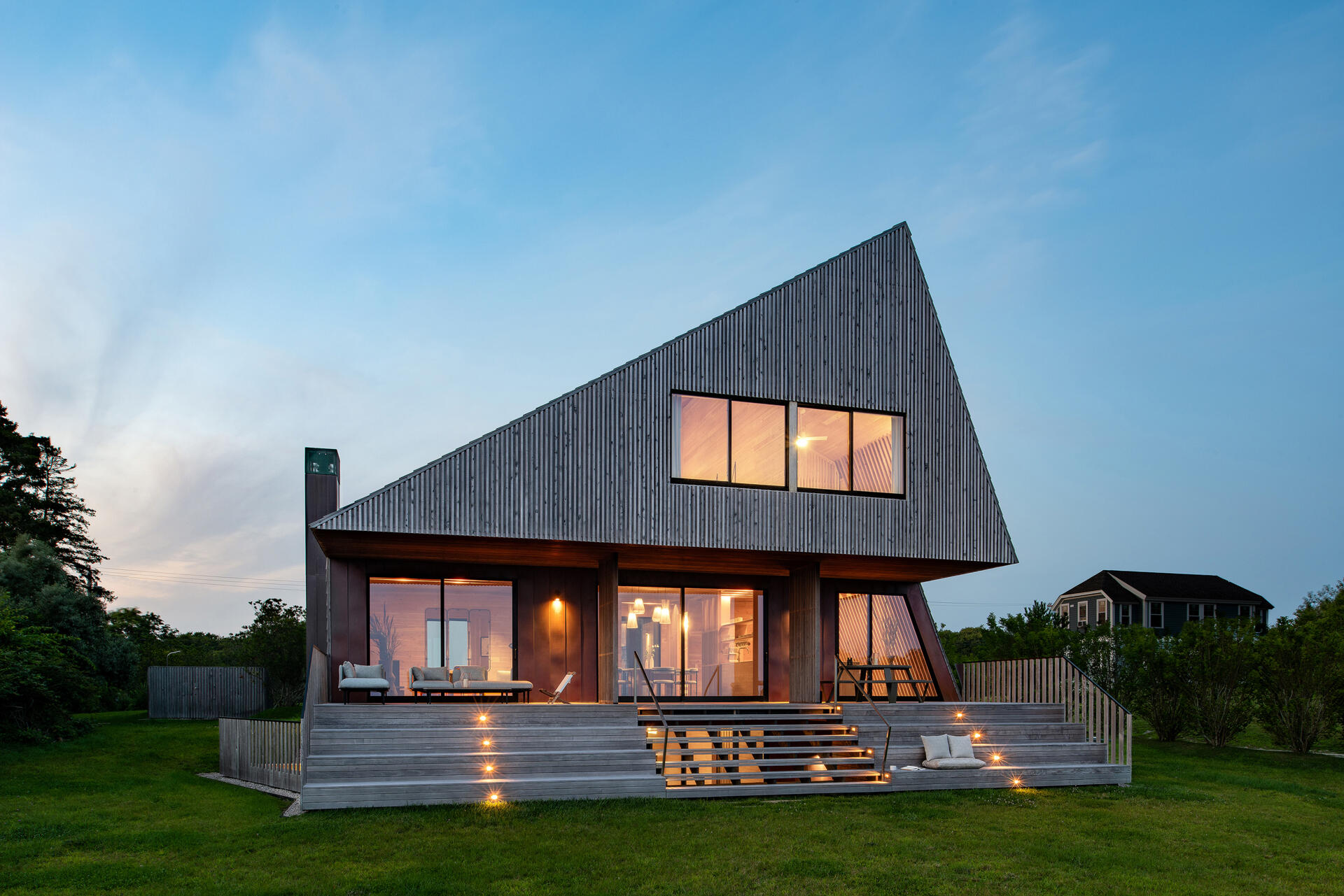 A cedar and copper deck that blurs indoors and out, built to age beautifully in the island’s salt air and frame endless ocean views.