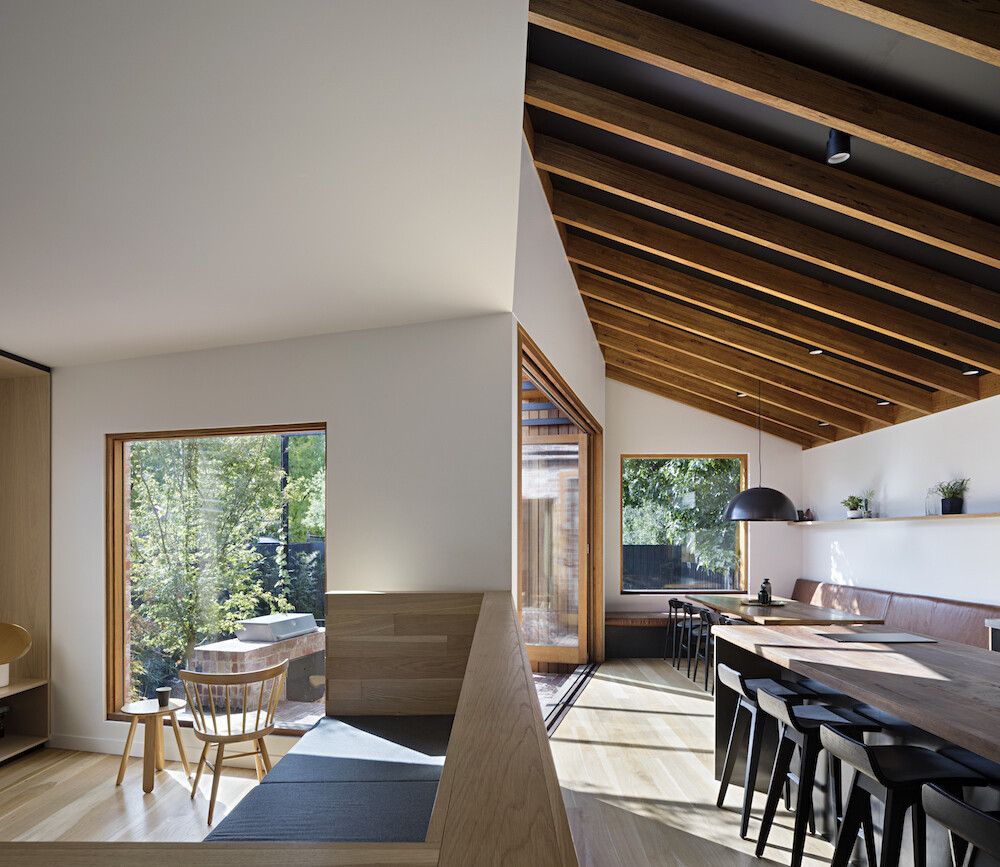 An oversized Donald Judd inspired sofa defines the living area and creates a cosy spot for family time while keeping the space open and connected.